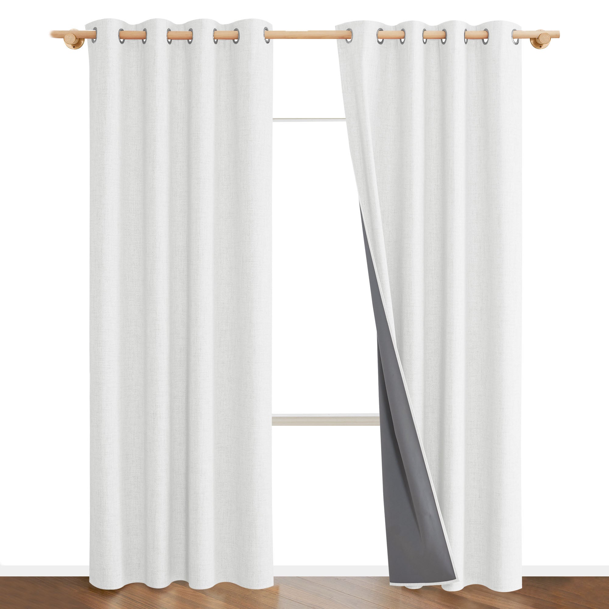 White linen curtains on a rod, with one panel pulled back to show the dark gray 100% blackout liner.