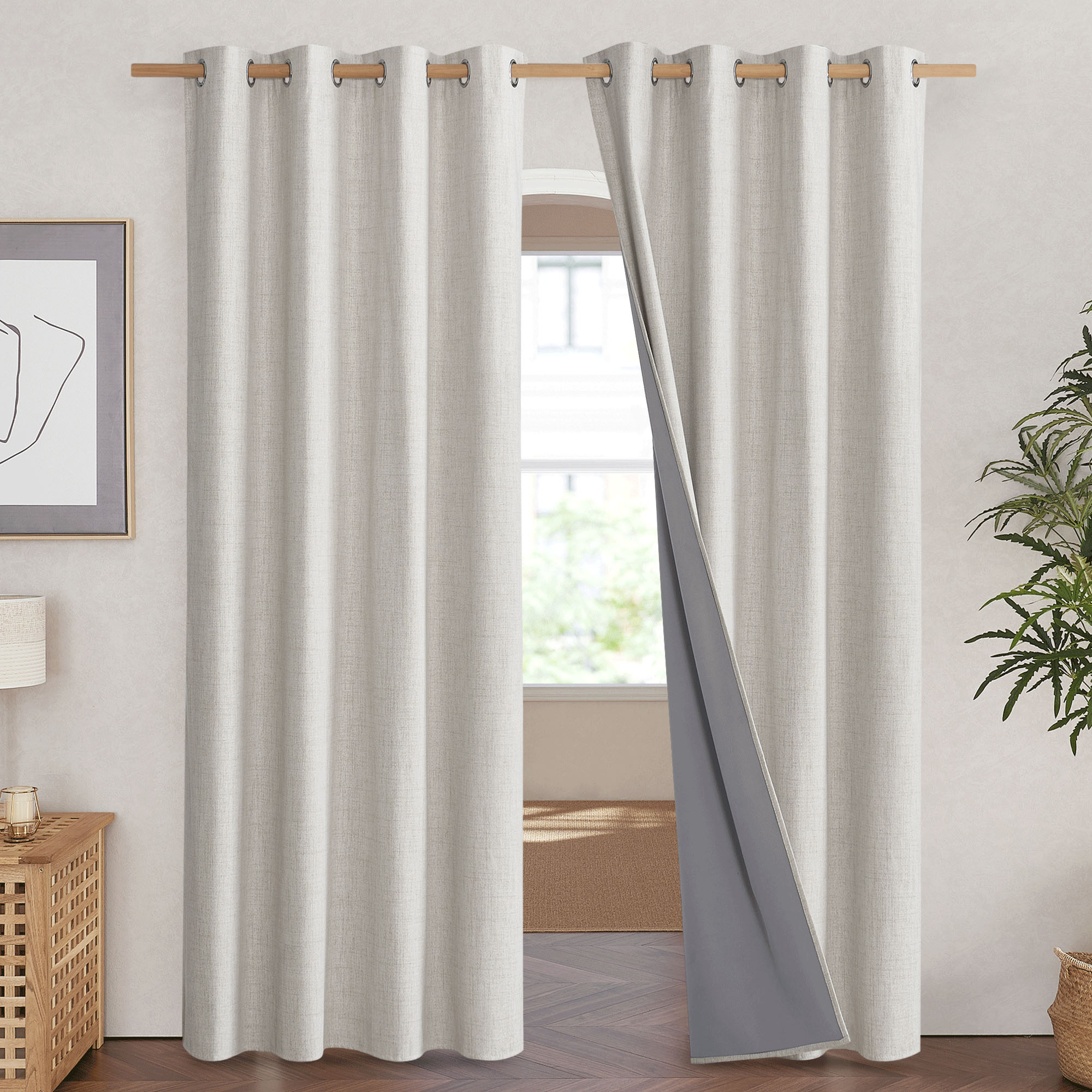Natural linen curtain with silver grommets, pulled back to reveal the integrated 100% blackout gray liner.