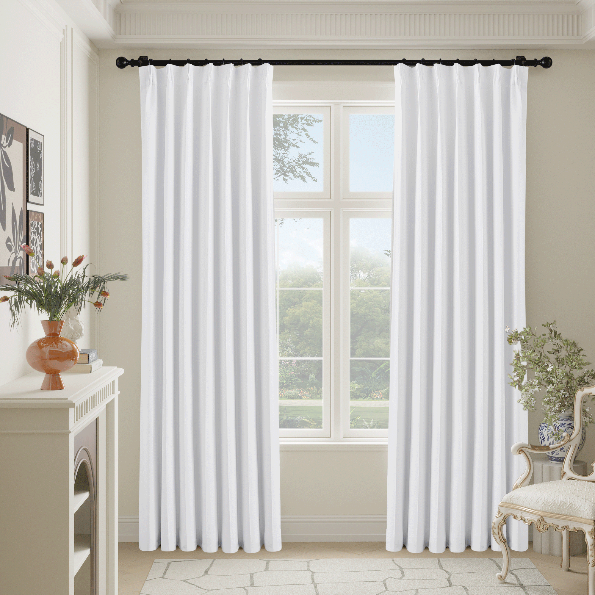 White Valentina Natural full blackout faux linen pinch pleated curtains drawn across a window in a bright room.