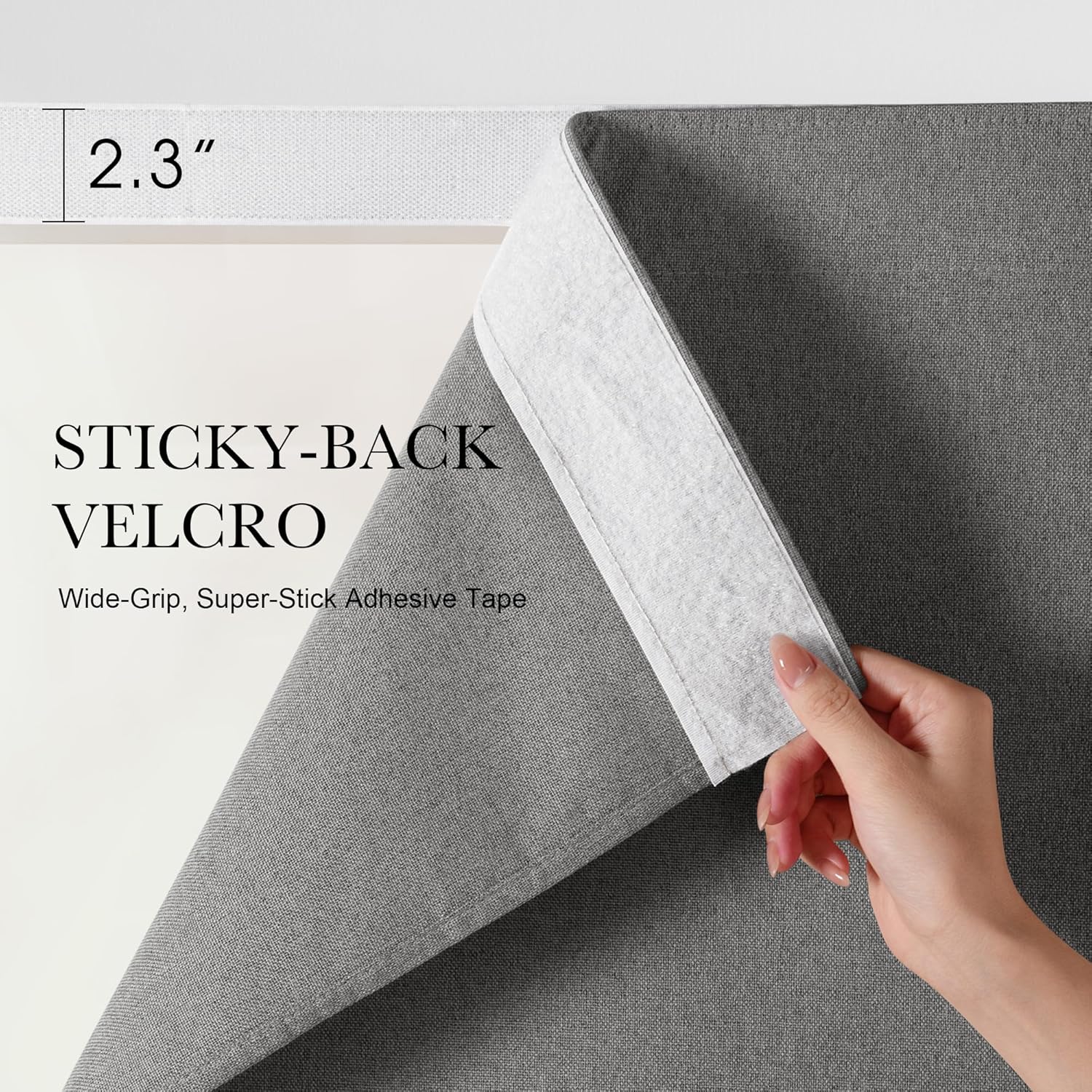Hand peeling gray textured fabric to reveal white 2.3-inch wide sticky-back Velcro adhesive tape.