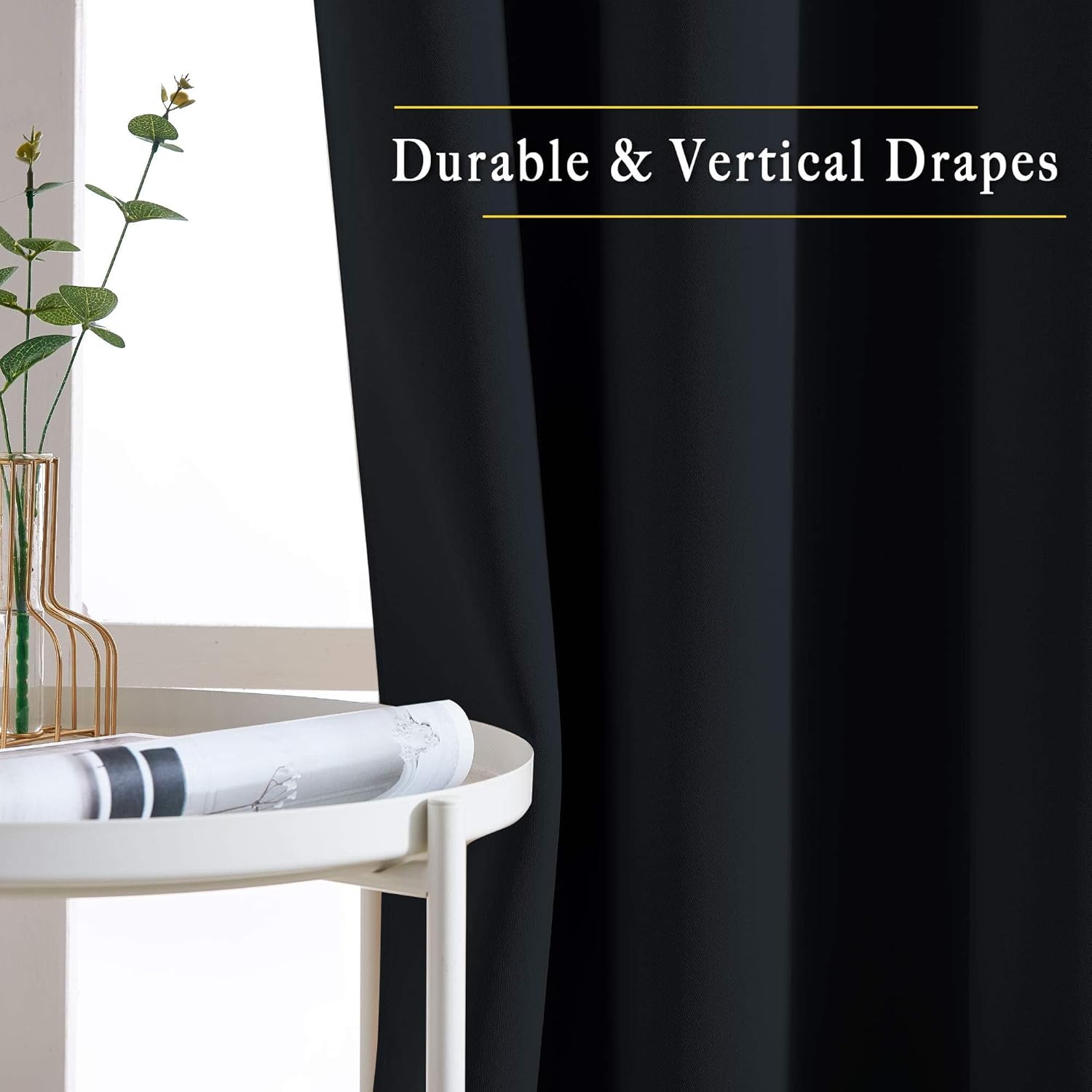 Close-up of NICETOWN black blackout curtain in a bedroom, highlighting its durable, vertical drapes next to a plant on a table.