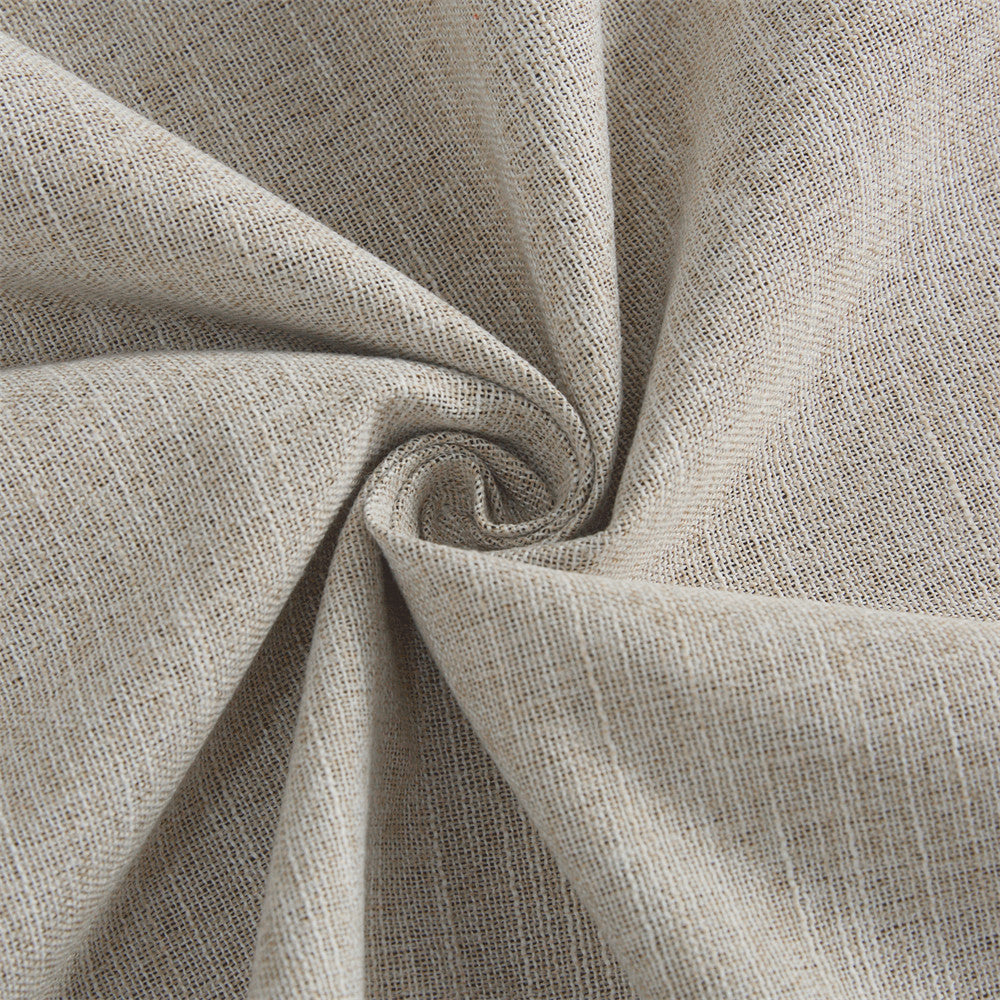 Close-up of beige faux linen fabric for blackout curtains, highlighting its textured weave and soft, natural appearance.