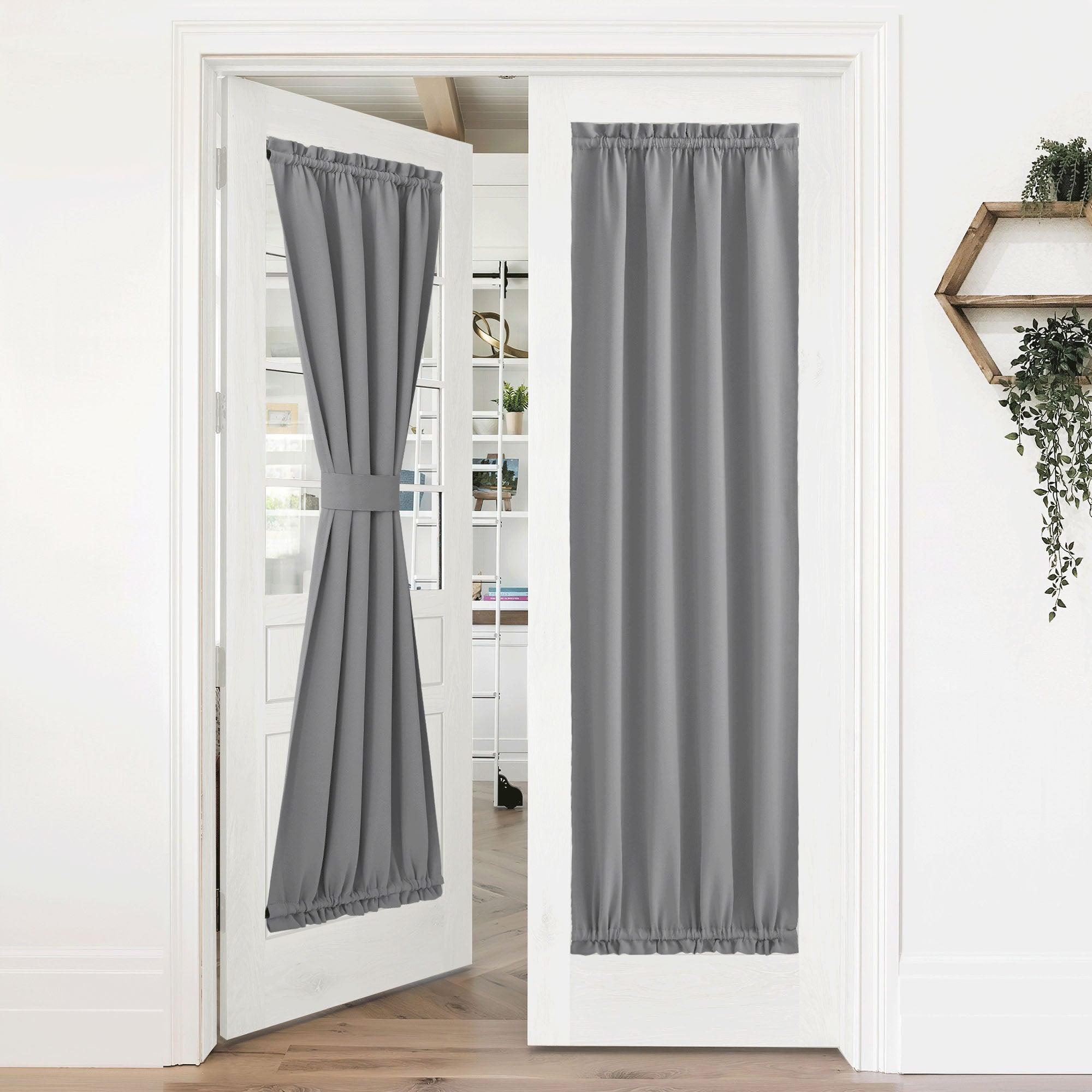 Grey 50% blackout privacy door curtains on white french doors. One tied back, the other fully drawn for complete privacy.