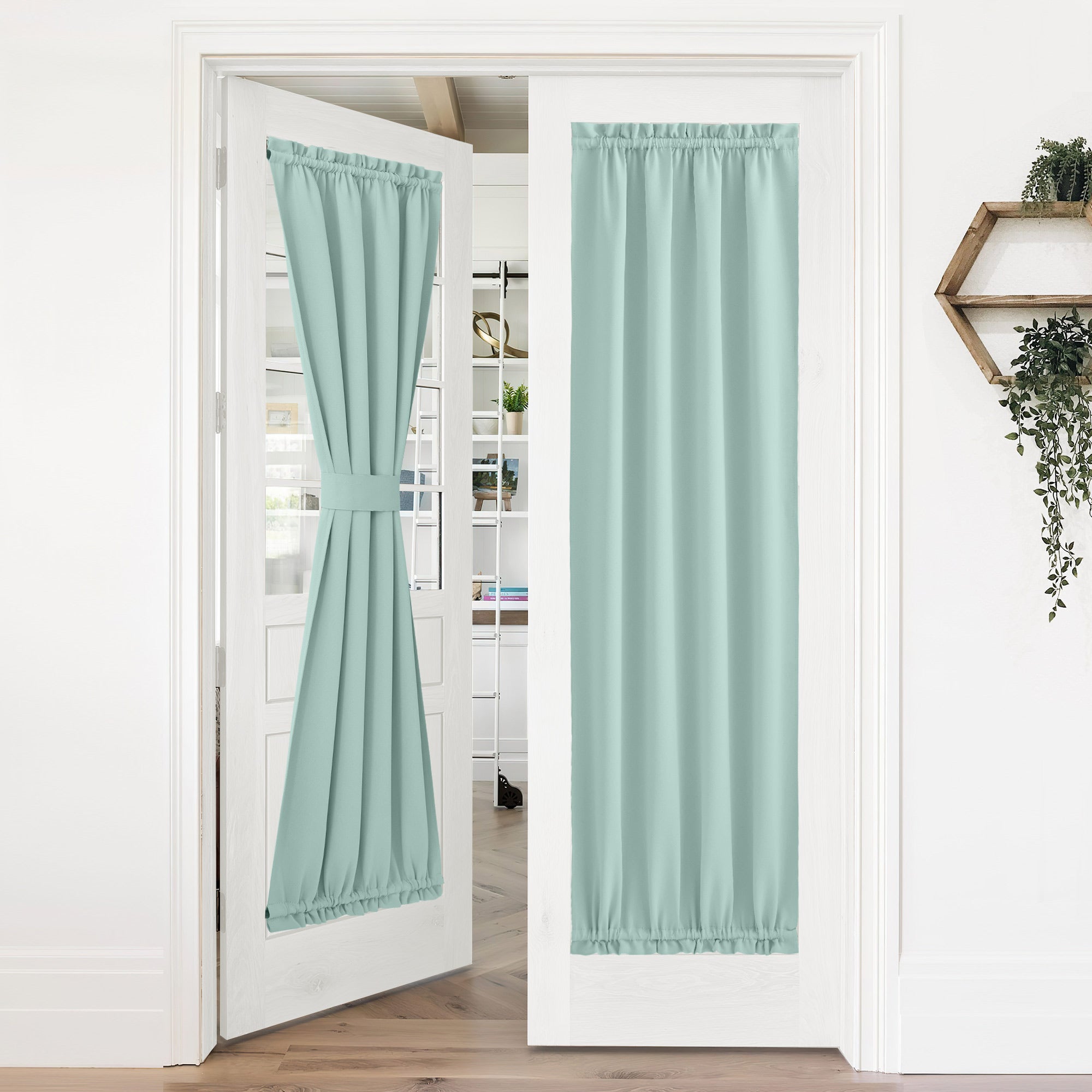 Mint green 50% blackout privacy door curtains on white French doors; one tied back, the other fully extended.
