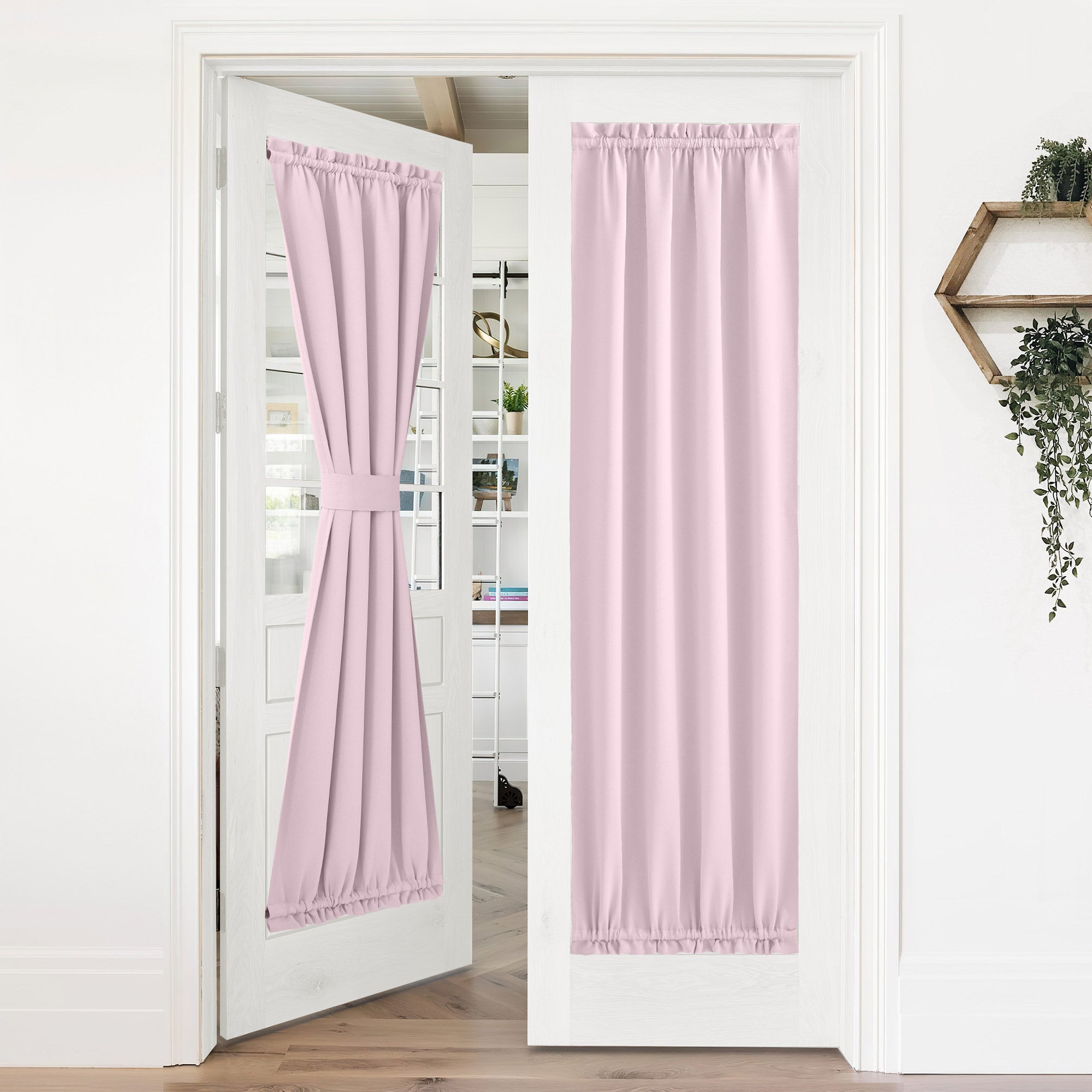Two pink 50% blackout privacy door curtains on white French doors. One is tied back, the other fully extended for light filtering.