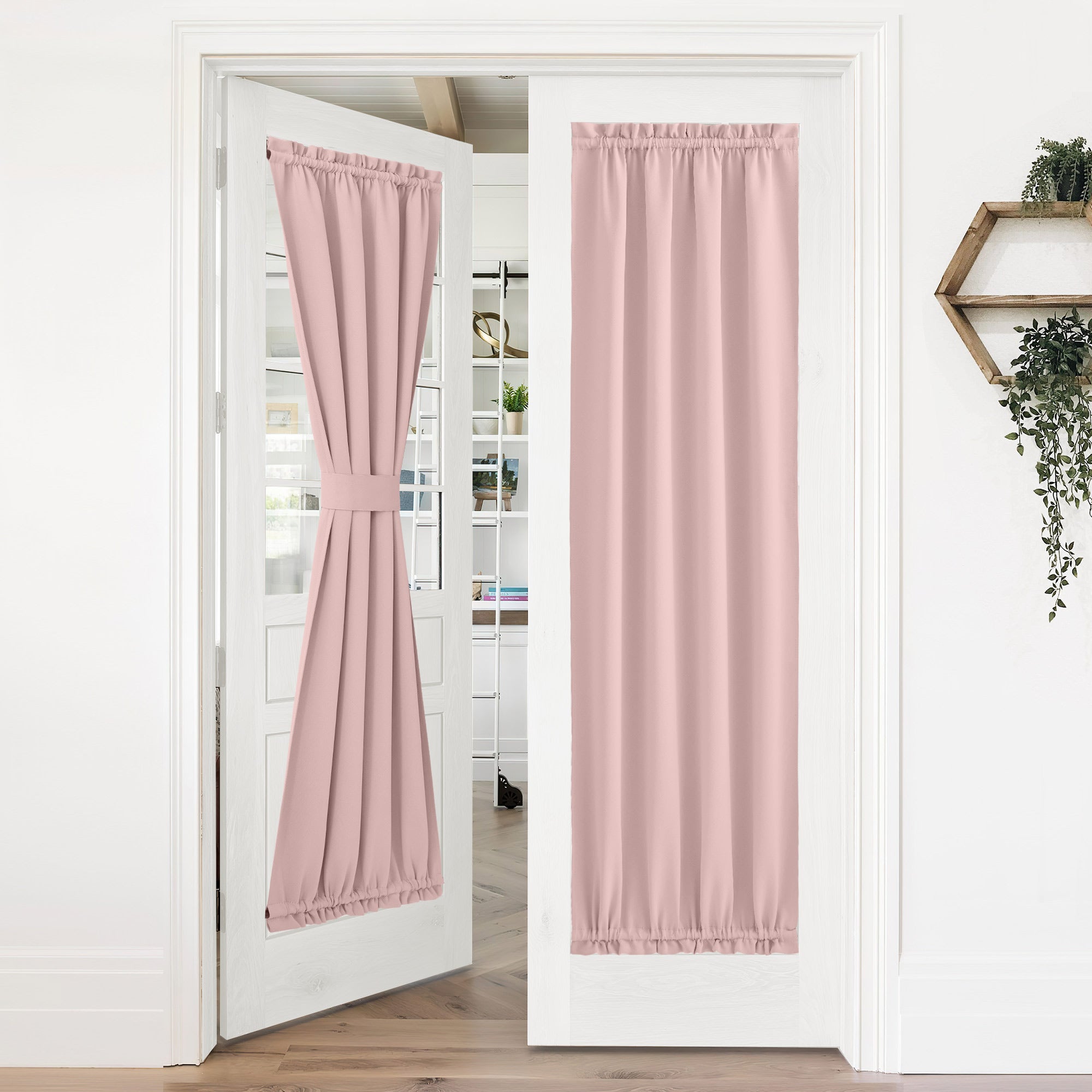 Pink 50% blackout privacy door curtains on white French doors. One curtain is tied back, the other hangs straight, showing versatile styling.