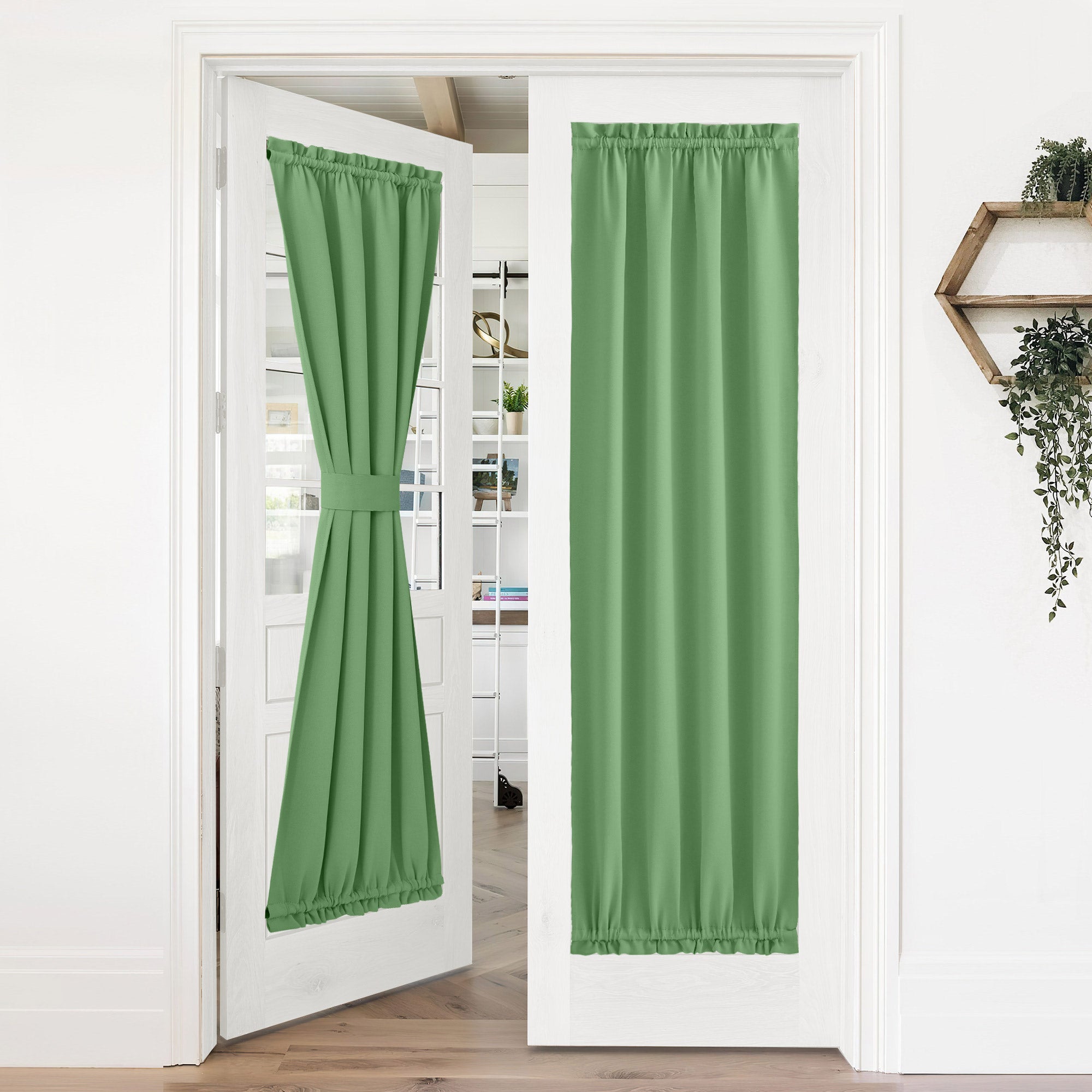 Green 50% blackout privacy door curtains on French doors. One tied back, one fully extended for privacy.
