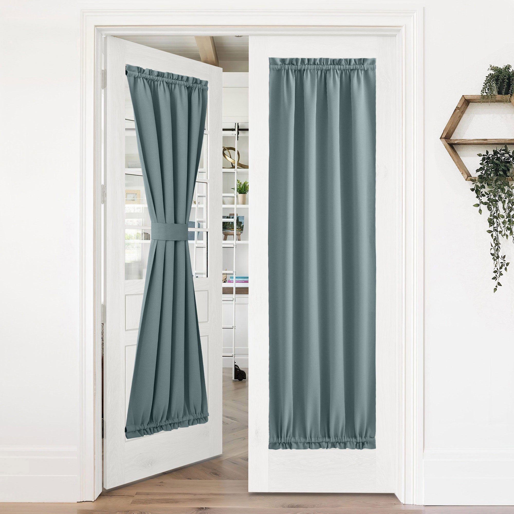 Two teal 50% blackout privacy door curtains on white French doors; one tied back, one fully extended for light control and privacy.