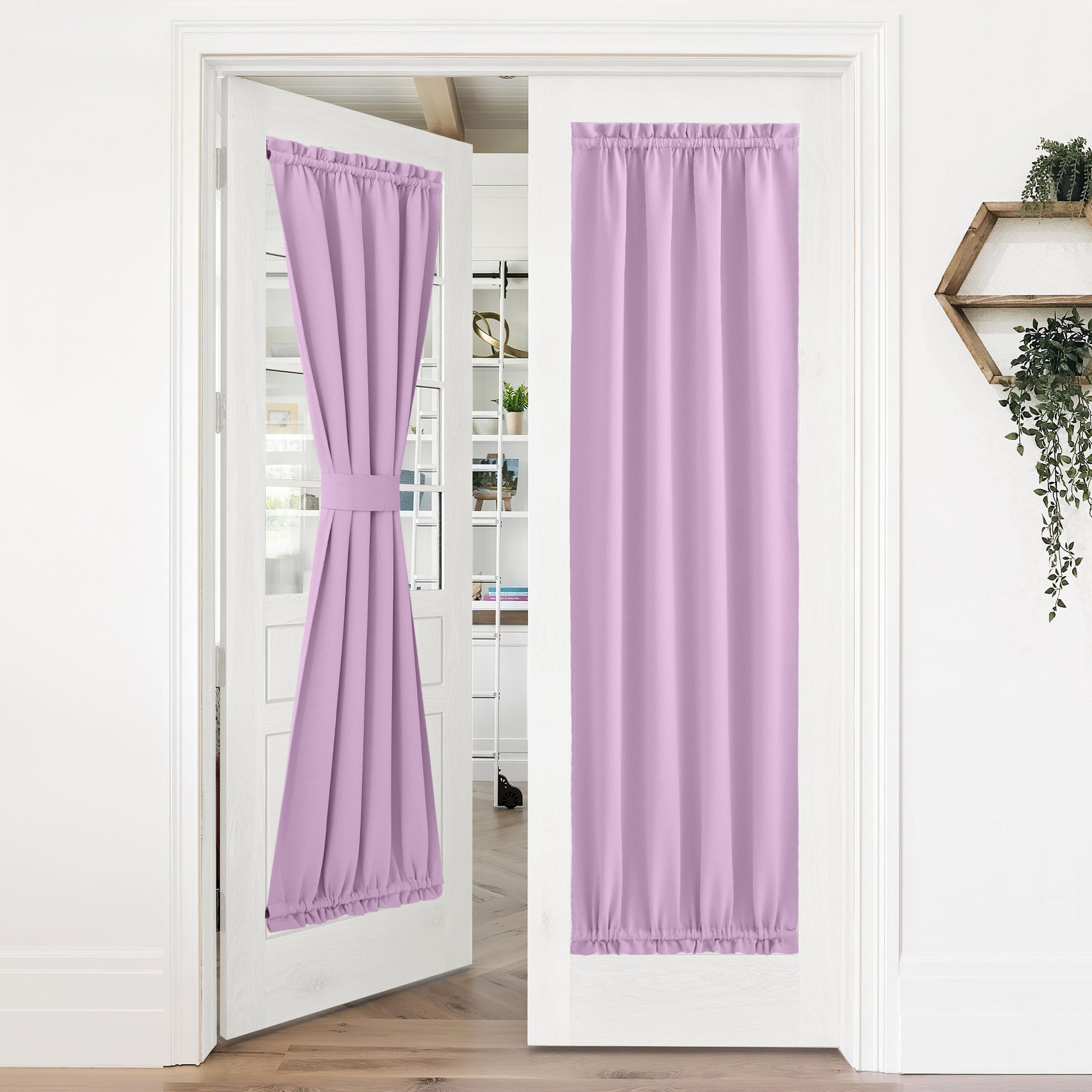 Lilac 50% blackout door curtains on white French doors. One is tied back, the other hangs fully for complete privacy.