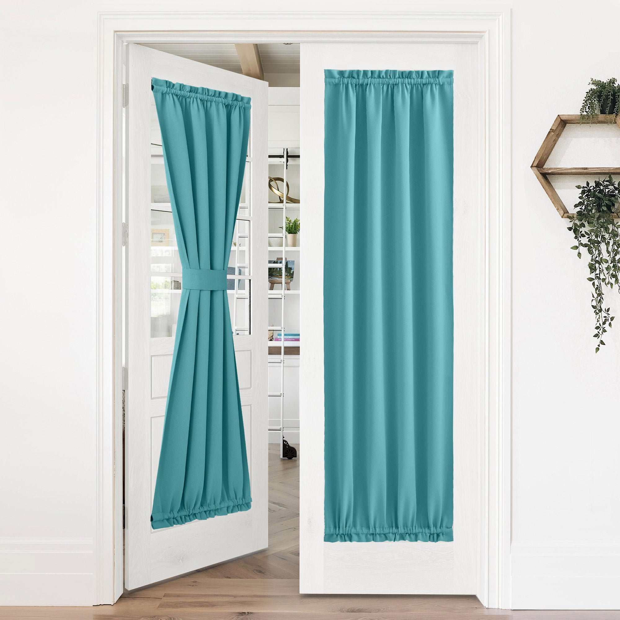 Teal 50% blackout privacy door curtains on white French doors; one tied back, the other fully covering.