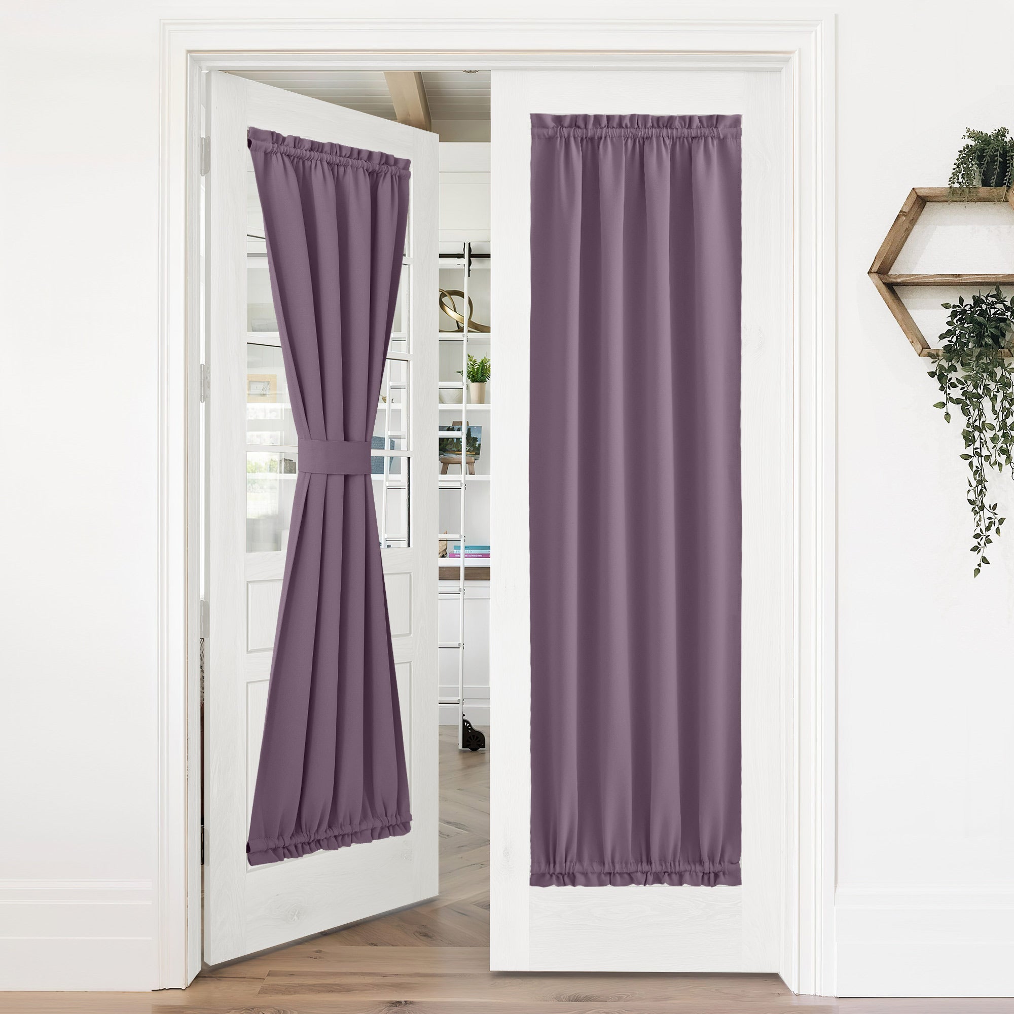 Purple 50% blackout privacy rod pocket door curtains on French doors, one tied back and one hanging straight.