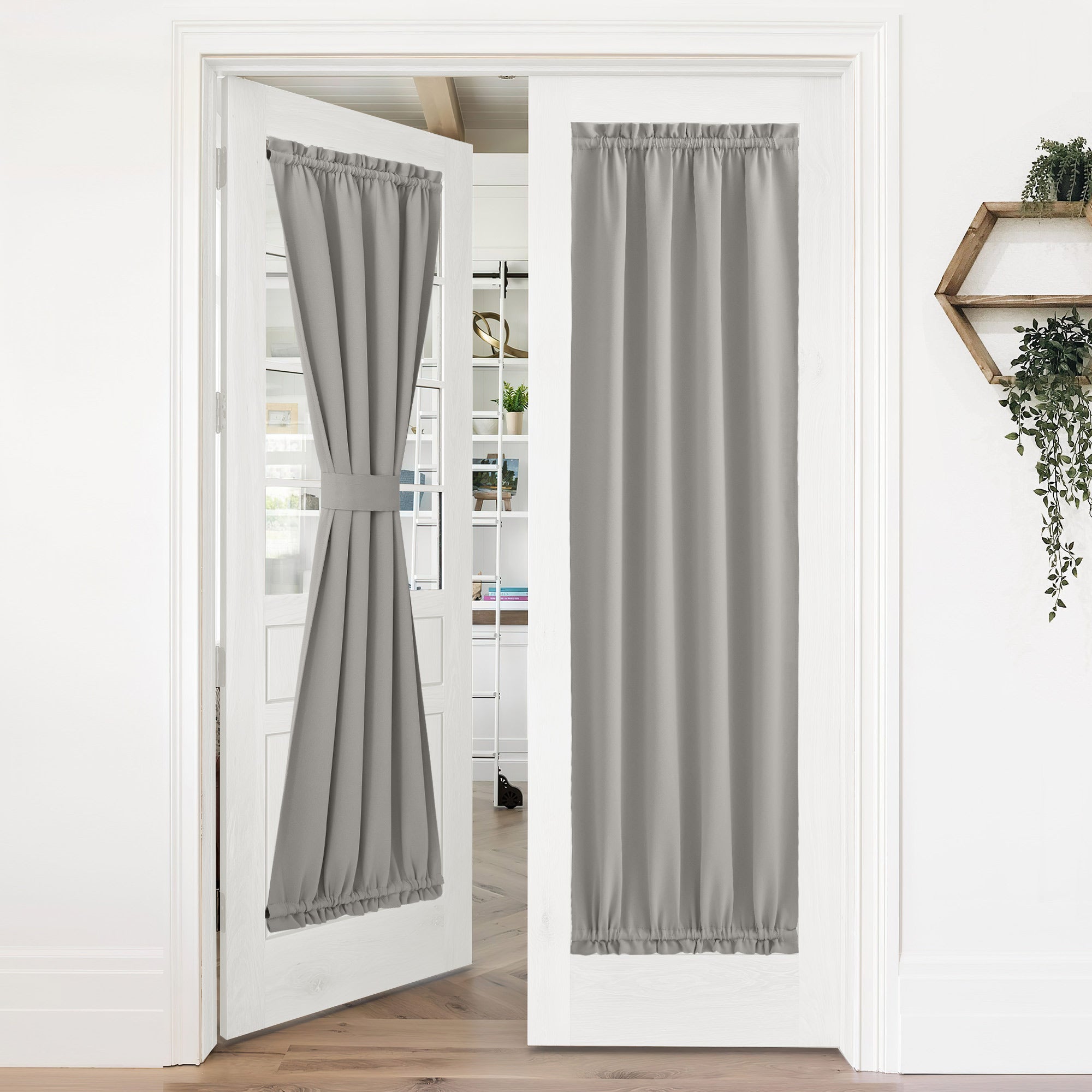Gray 50% blackout privacy door curtains on white French doors; one tied back, the other fully extended for privacy.