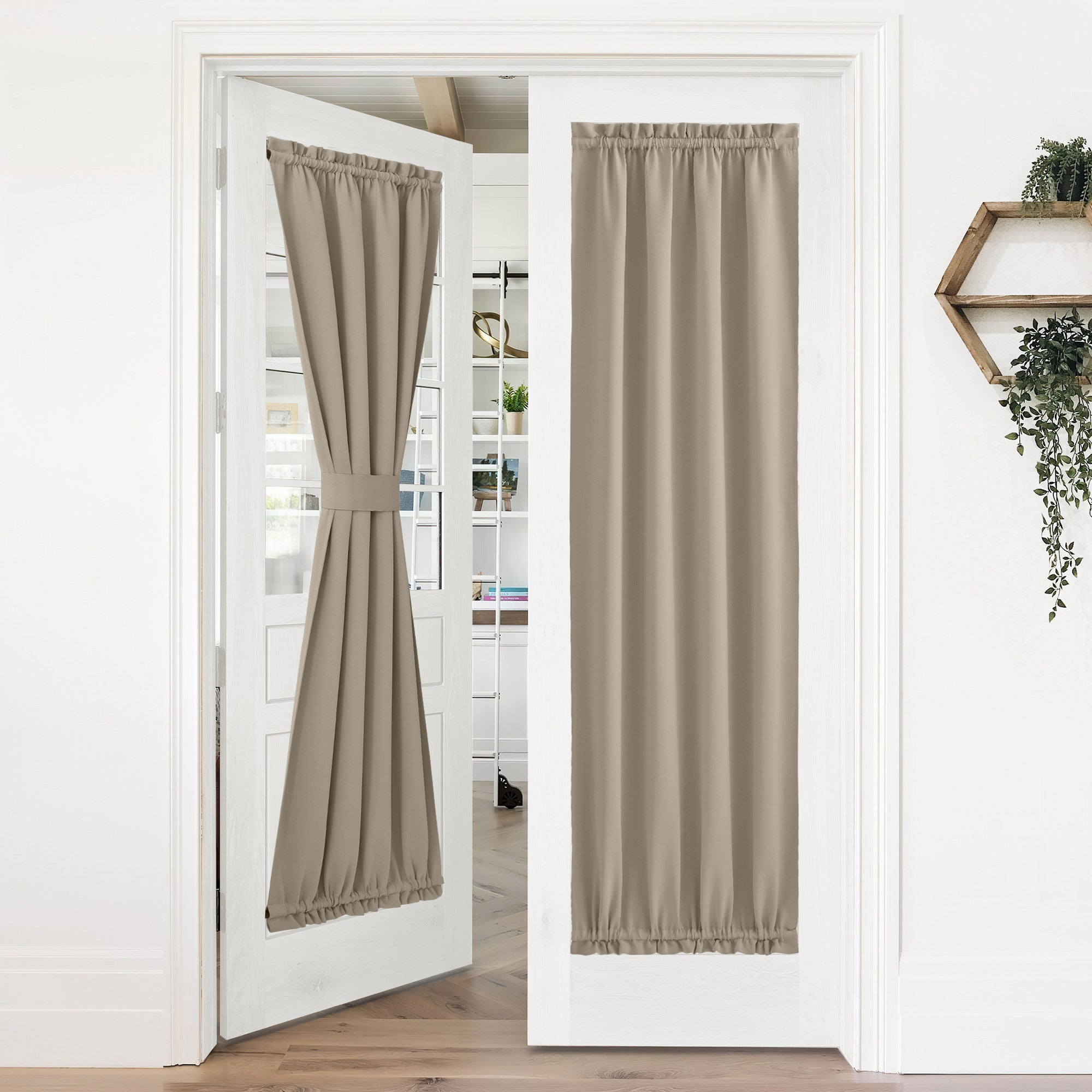 Beige 50% blackout privacy door curtains on white French doors, one panel tied back, the other fully closed.