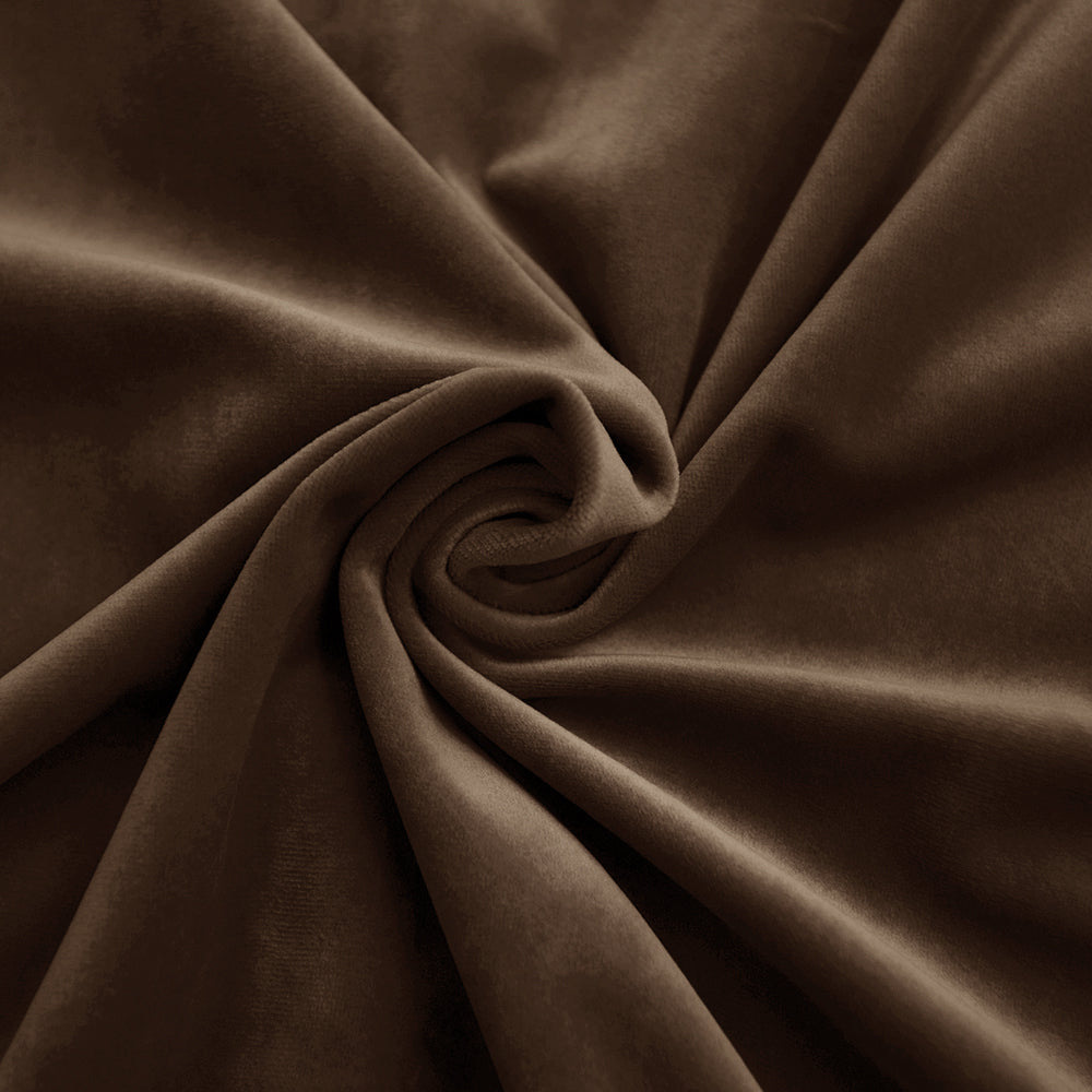 Luxurious brown velvet fabric swatch draped with folds and a swirl, highlighting its soft texture and rich sheen.