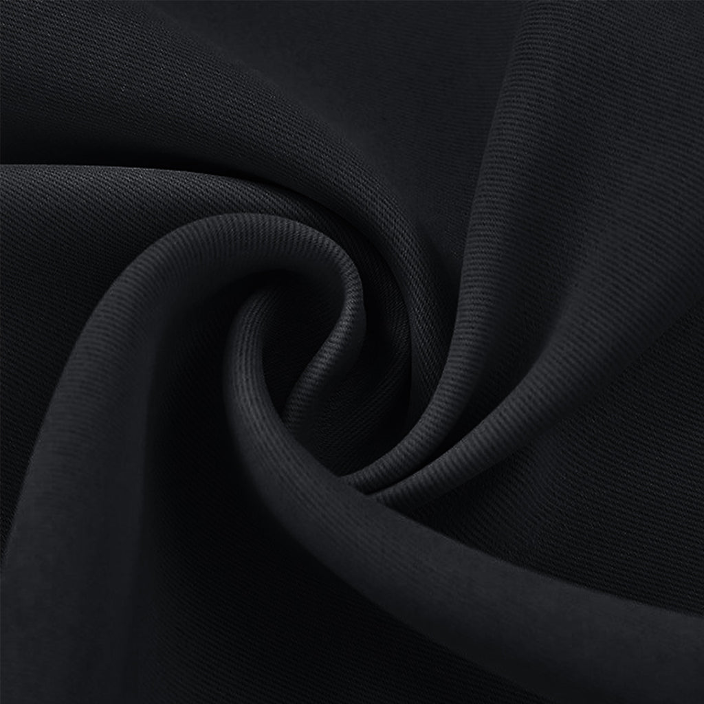 Detailed close-up of a swirled black blackout fabric swatch, highlighting its rich texture and quality material.