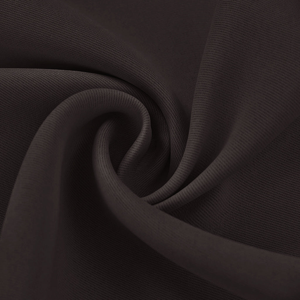 Close-up of a dark brown blackout fabric swatch showing its soft, opaque texture with natural folds.