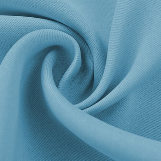 Close-up of light blue blackout fabric swatch, showing the smooth texture and distinct diagonal ribbed weave.