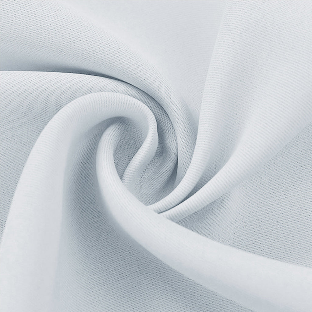 Close-up of white blackout fabric swatch showing a textured weave and soft, elegant drape.