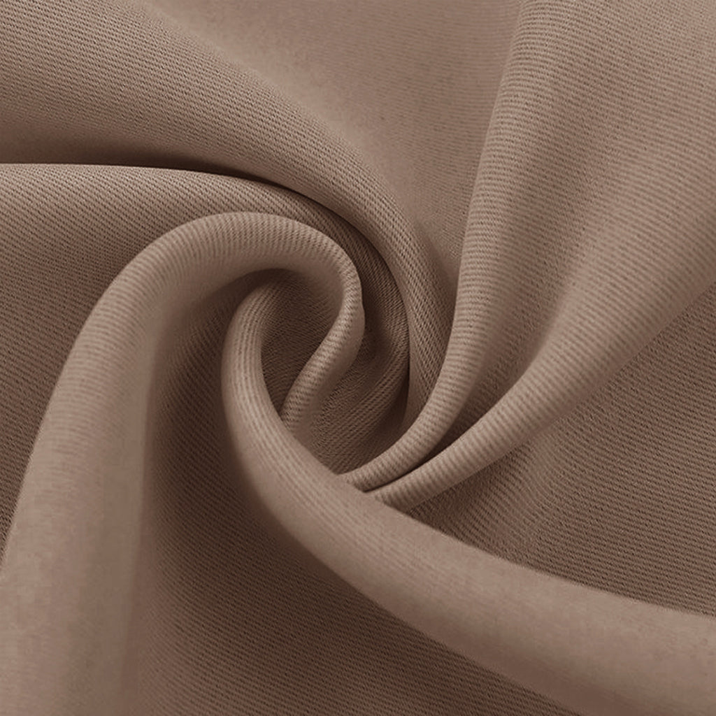 Light brown blackout fabric swatch, draped close-up to show the tight weave and smooth texture.