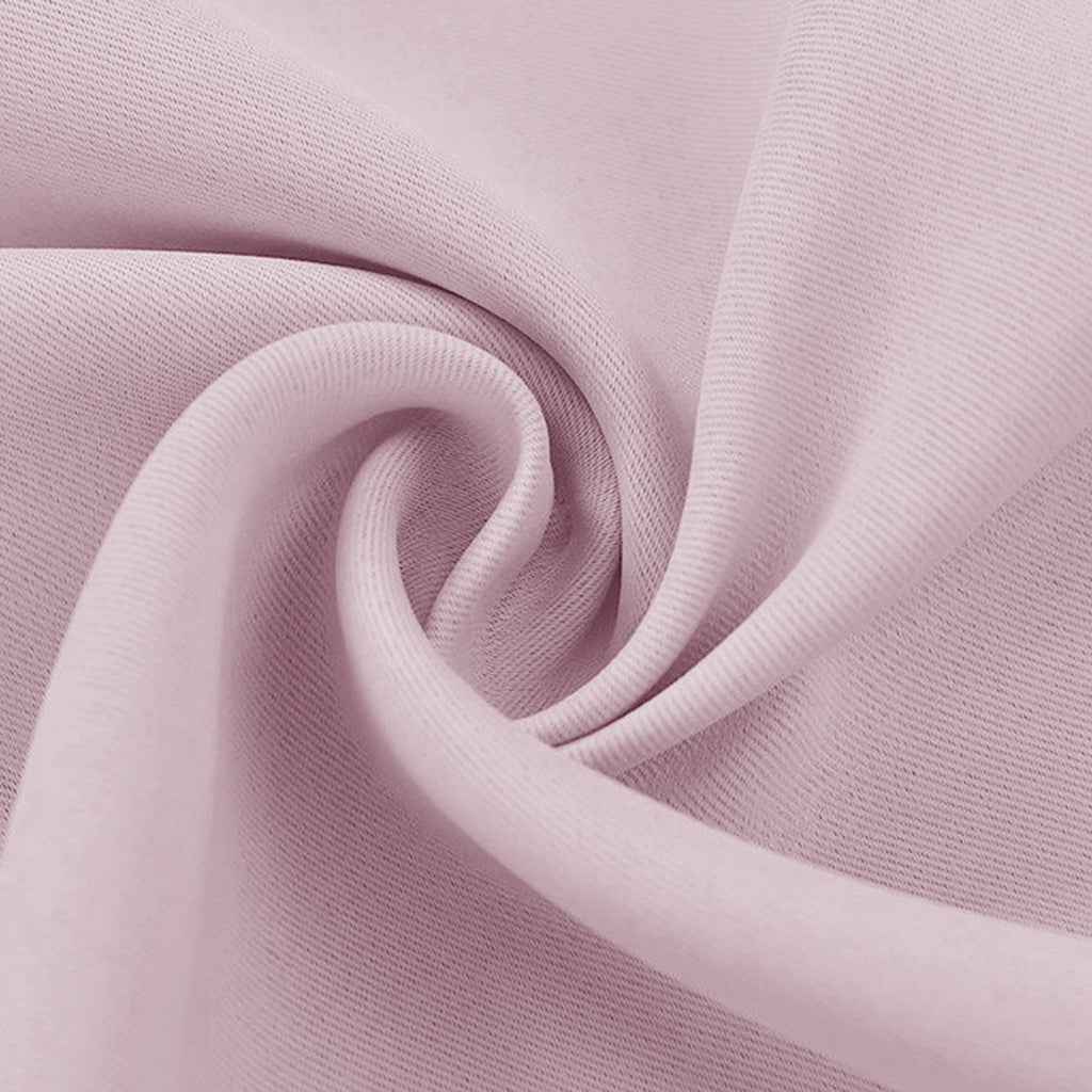 Dusty rose blackout fabric swatch with a subtle weave texture visible in soft, swirling folds.