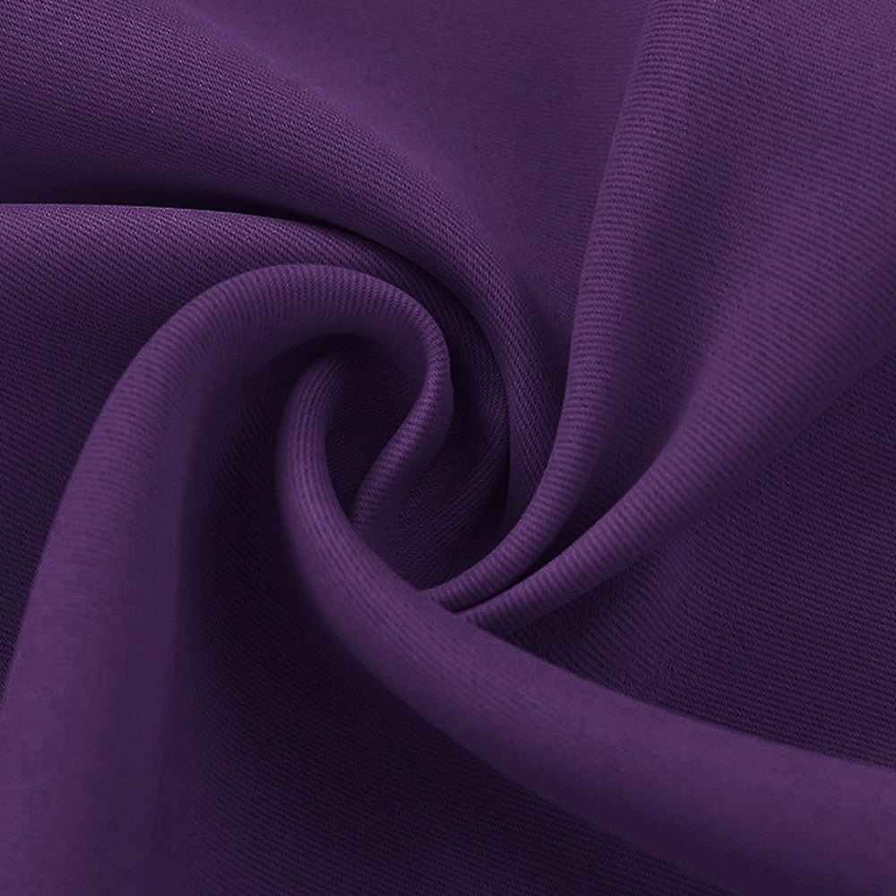Close-up of a folded deep purple blackout fabric swatch, highlighting its smooth texture and tight weave for optimal light blocking.