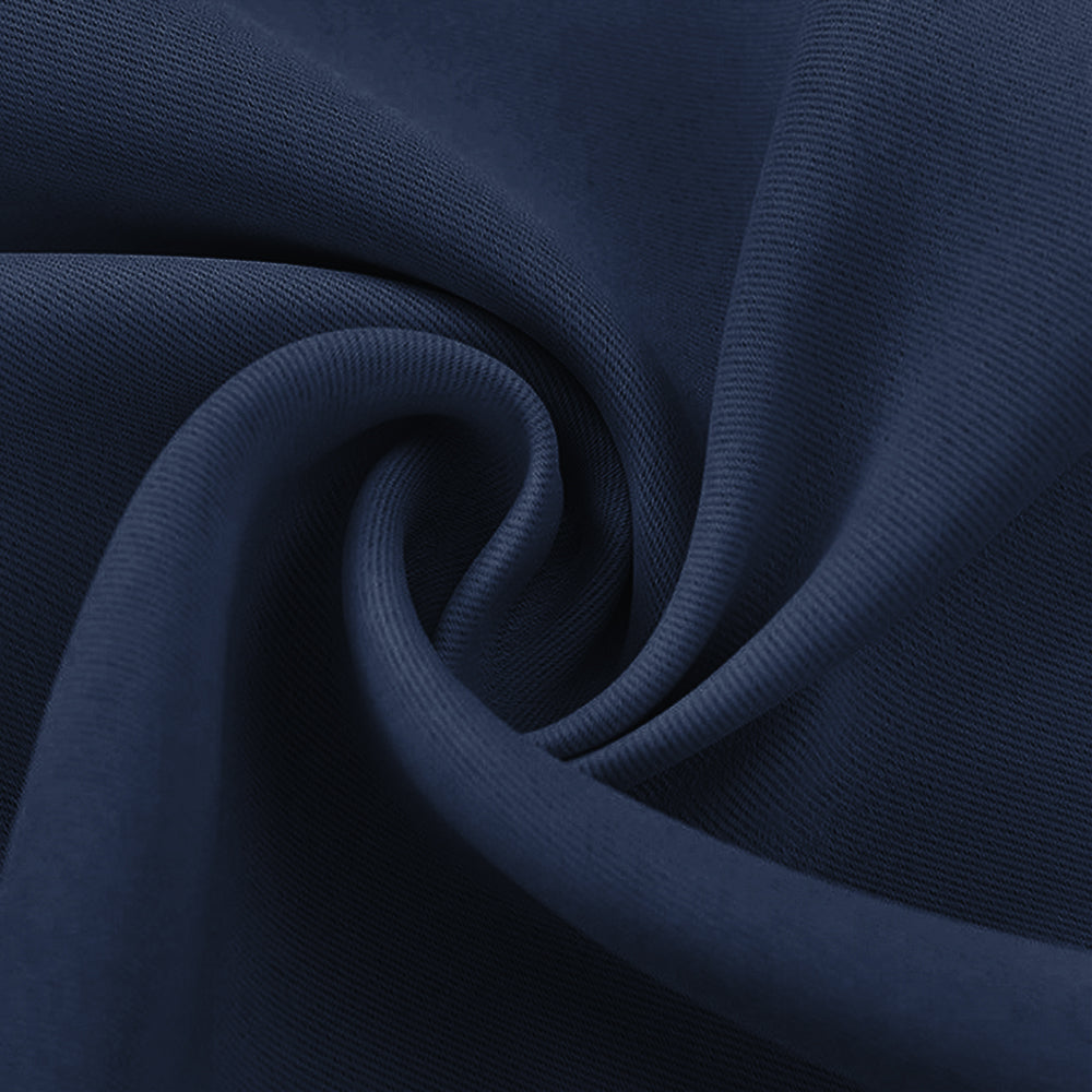 Detailed view of deep navy blackout fabric swatch with subtle texture and soft, flowing drape.