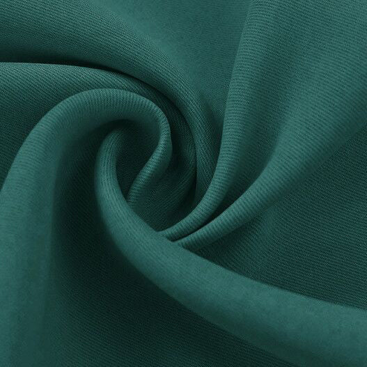 Close-up of a rich teal blackout fabric swatch, highlighting its subtle texture and soft folds.