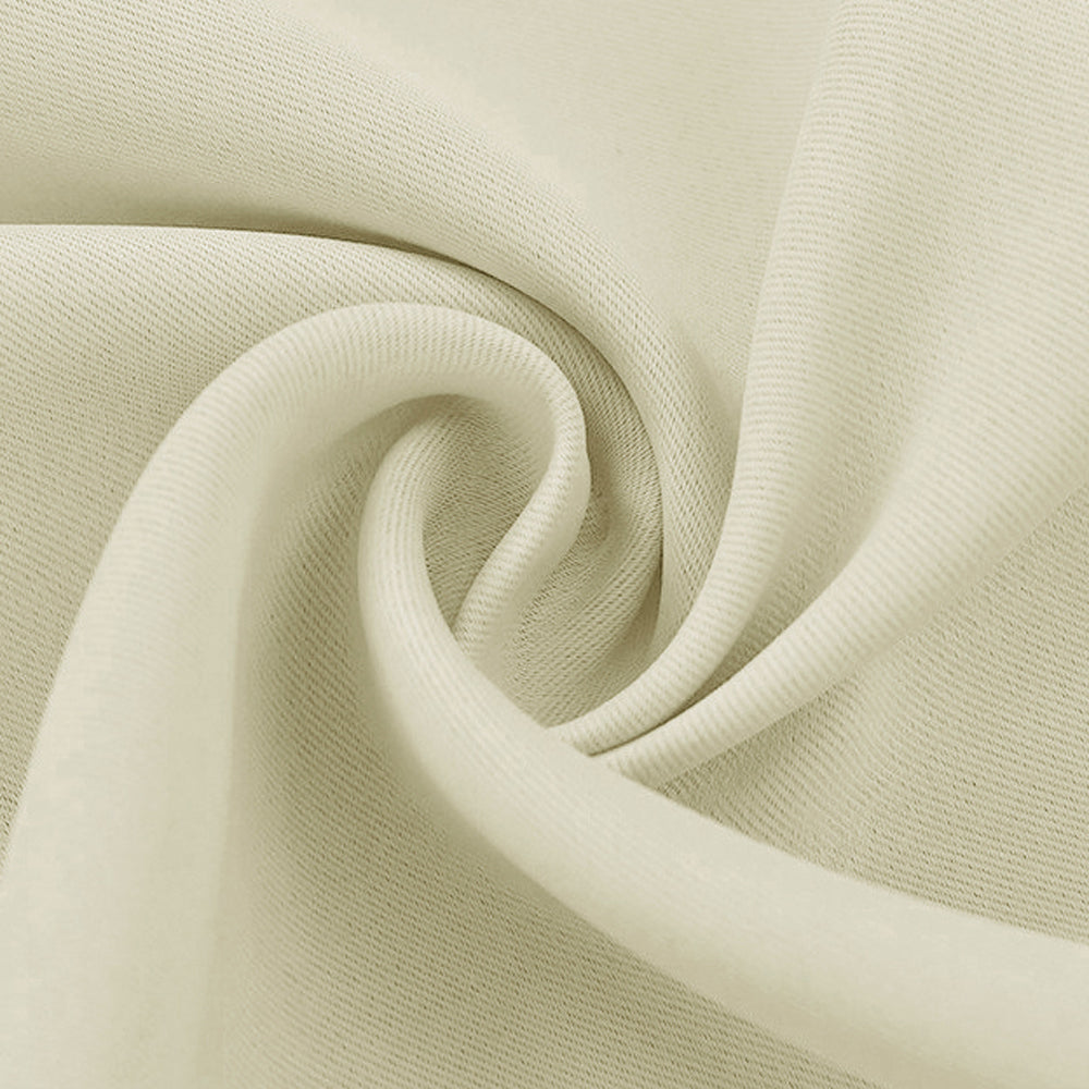 Close-up of a cream blackout fabric swatch, showing its soft texture and subtle weave details when folded.
