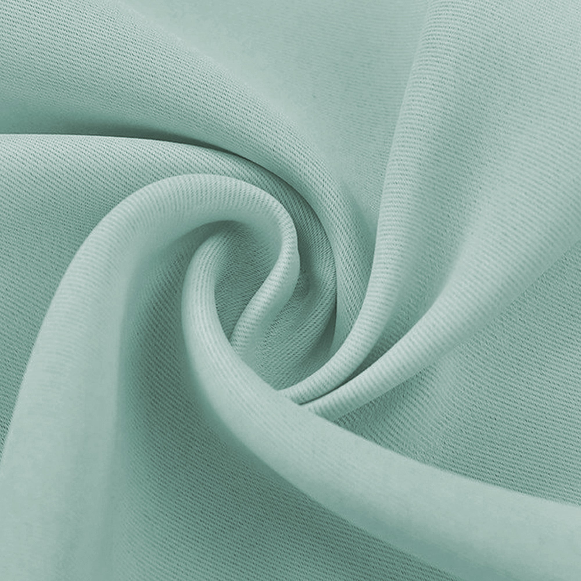 Close-up of a soft, light teal blackout fabric swatch, showcasing its fine texture and elegant drape.