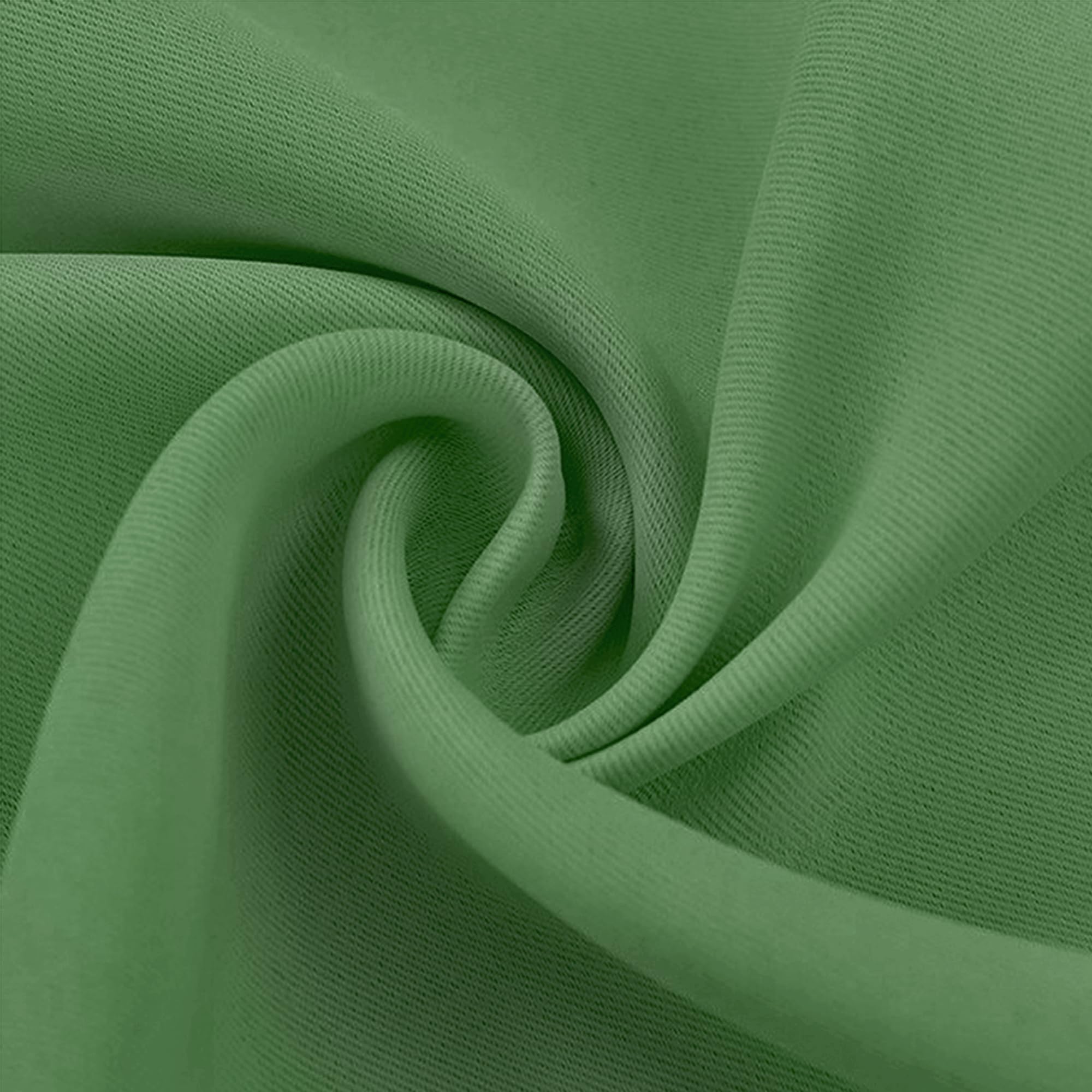 Close-up of a folded sage green blackout fabric swatch, highlighting its fine weave texture and soft material.