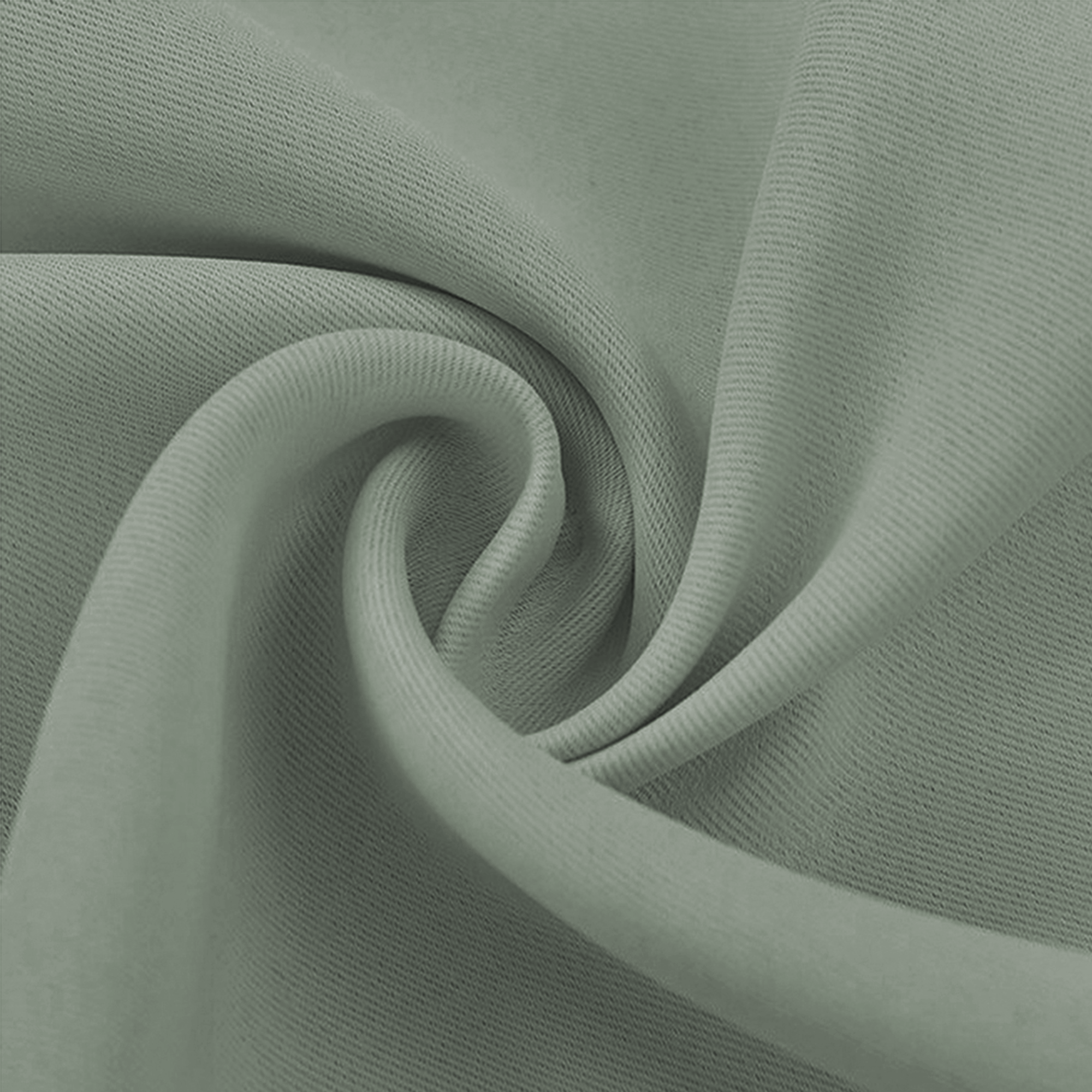 Close-up of a sage green blackout fabric swatch, showing its fine woven texture and soft folds.