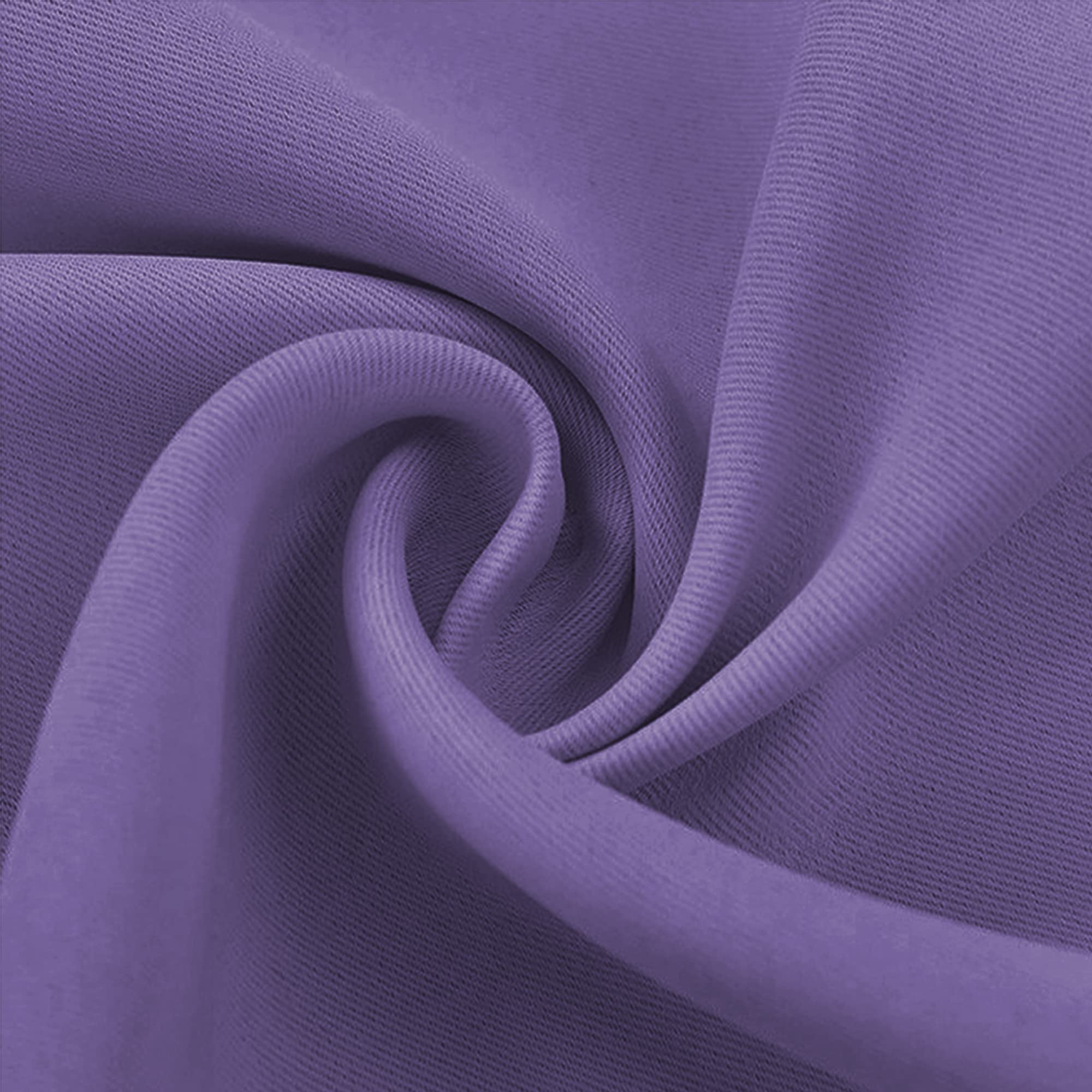 Close-up of a vibrant purple blackout fabric swatch, detailed weave and soft folds highlight the material's texture.