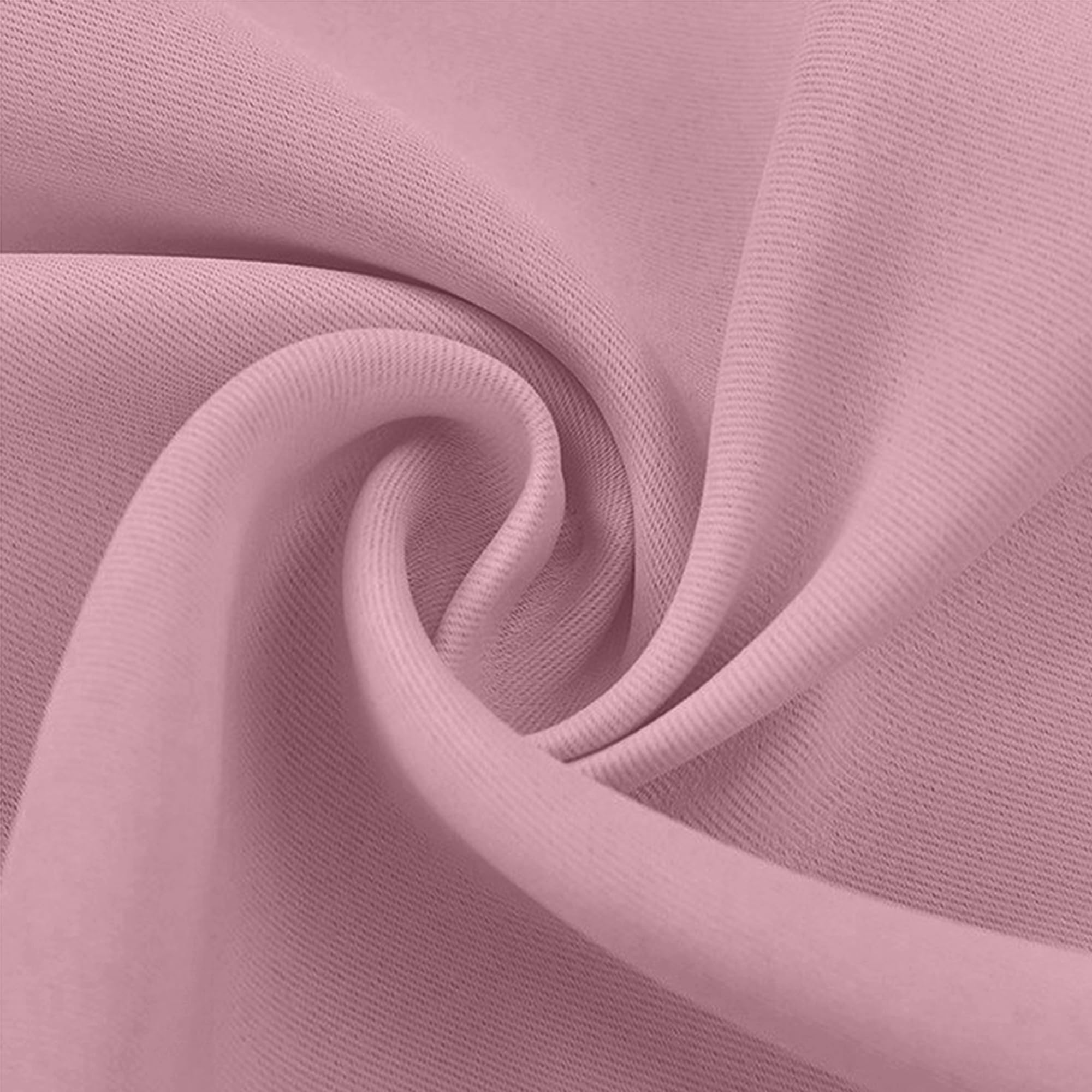 Close-up of a pink blackout fabric swatch, showing its textured weave and soft, elegant drape.
