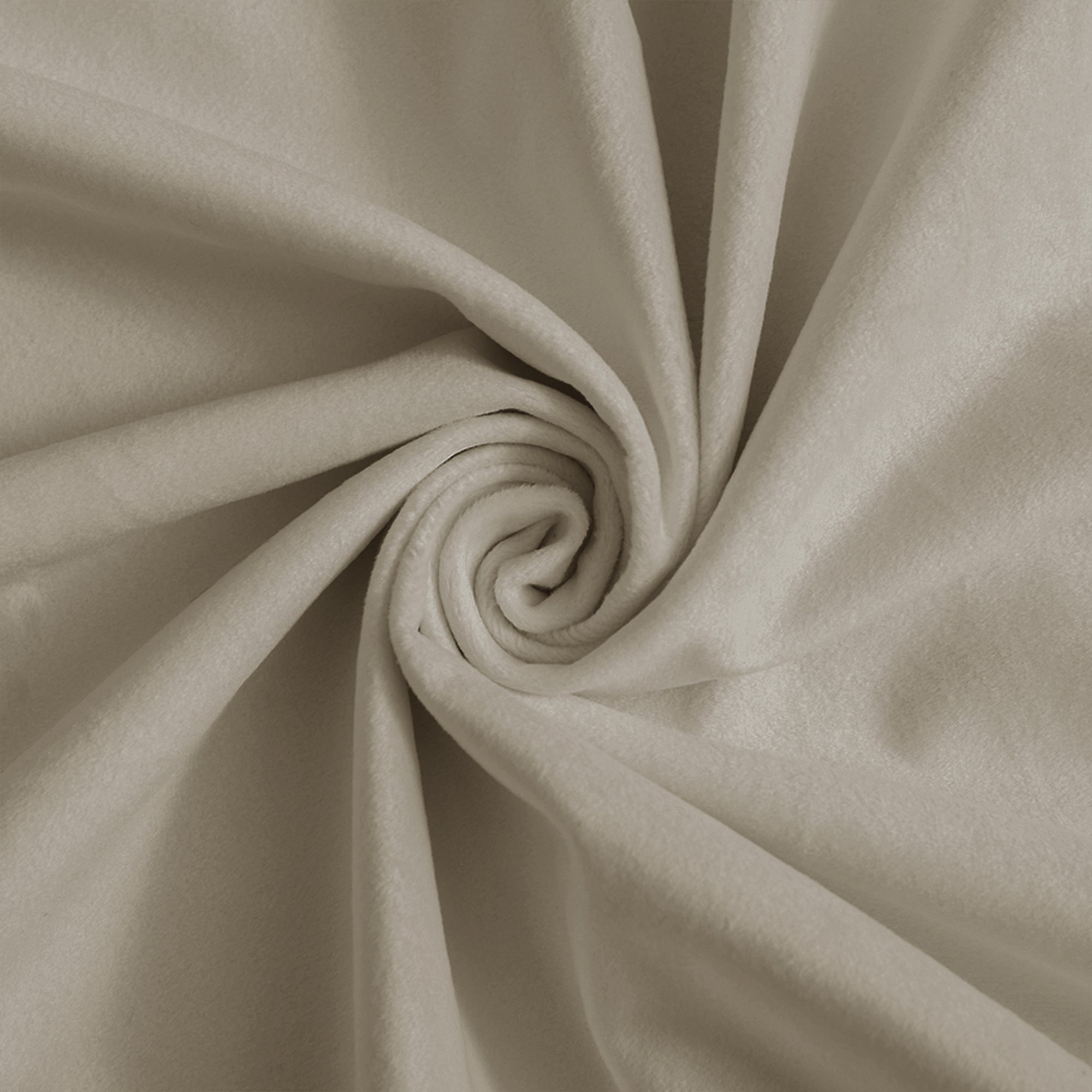 Light beige velvet fabric swirled in a spiral, highlighting its luxurious soft texture and elegant drape for home decor.