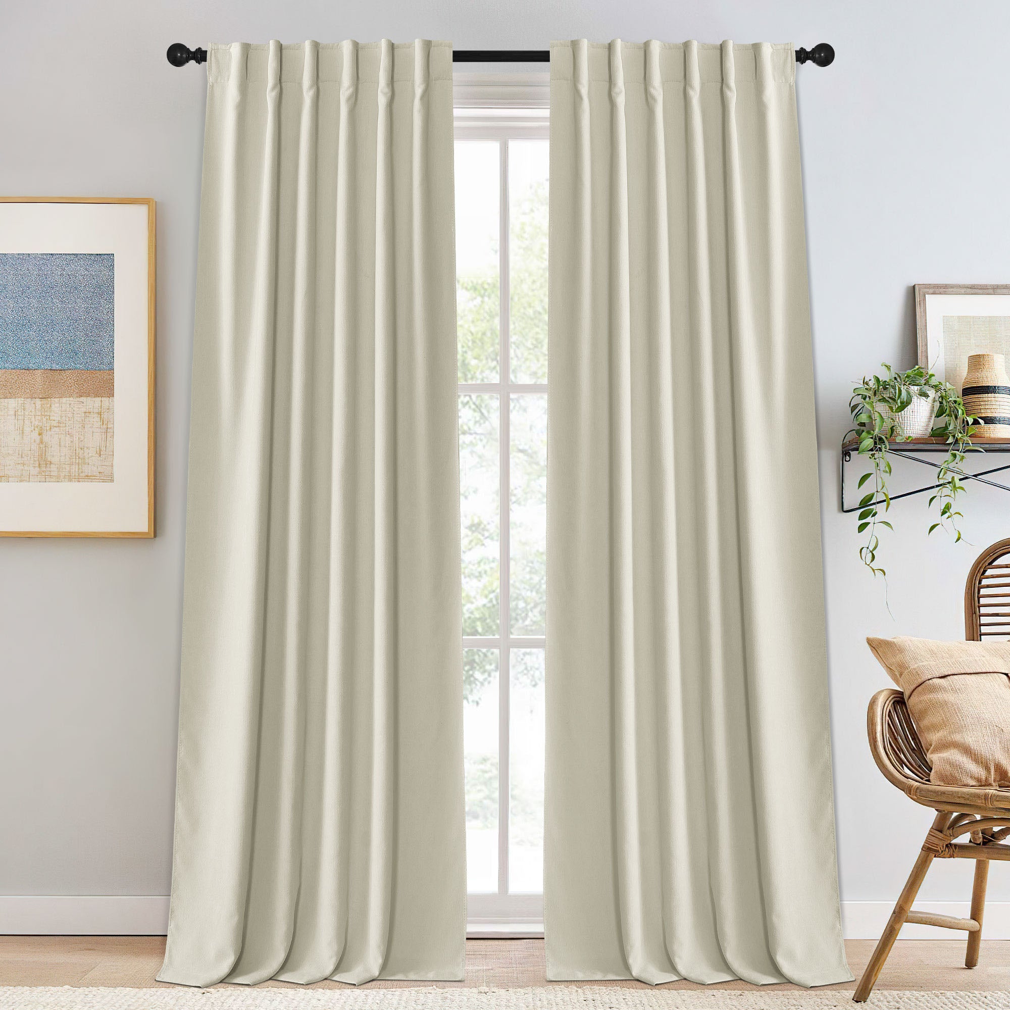 Cream chenille blackout curtains framing a window, featuring soft texture, ideal for light control and stylish home decor.