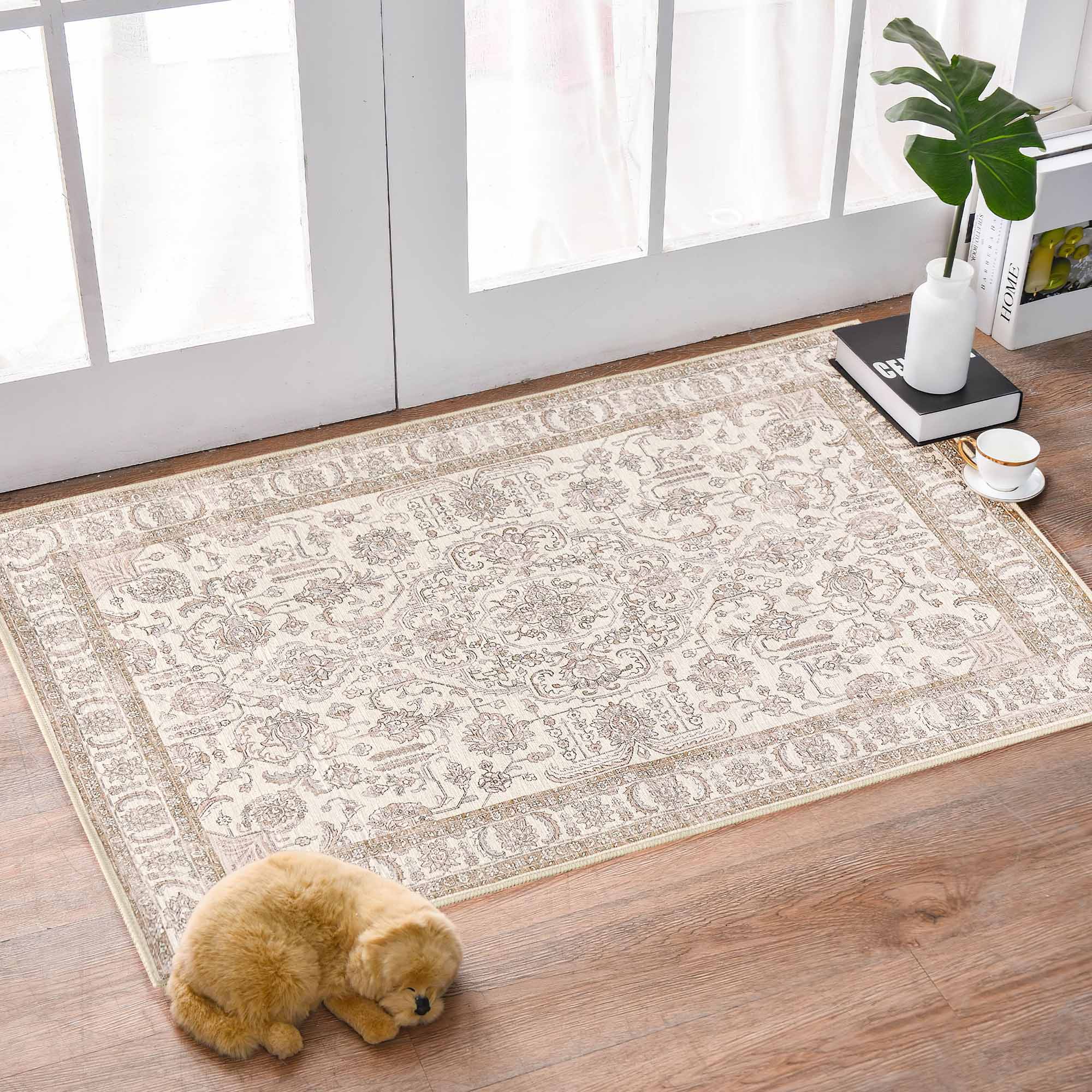 Floral's Dance beige chenille area rug displays intricate floral and medallion patterns on a warm wooden floor.