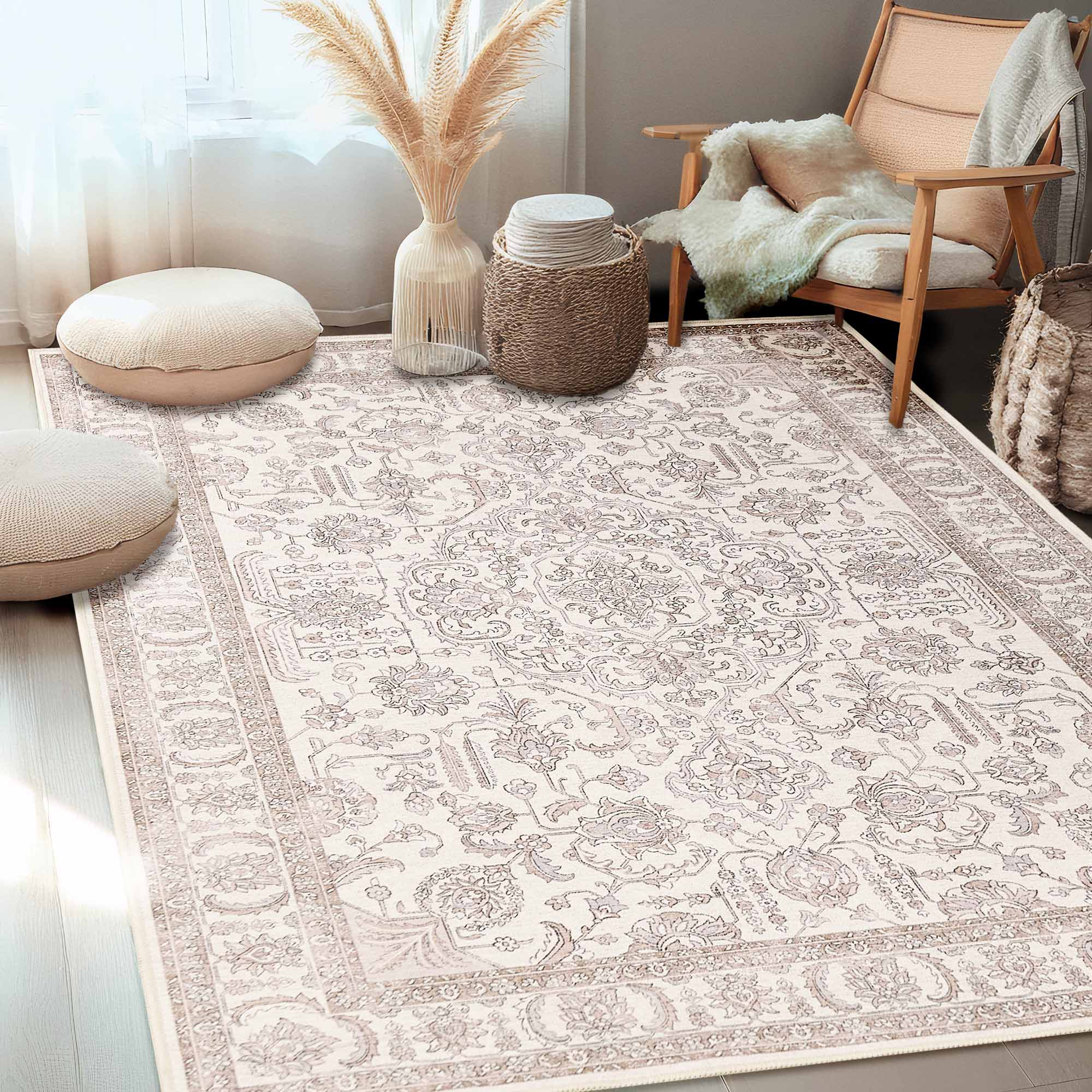 Light-colored chenille area rug with an elaborate floral dance pattern. Styled in a cozy living room setting with modern furniture.