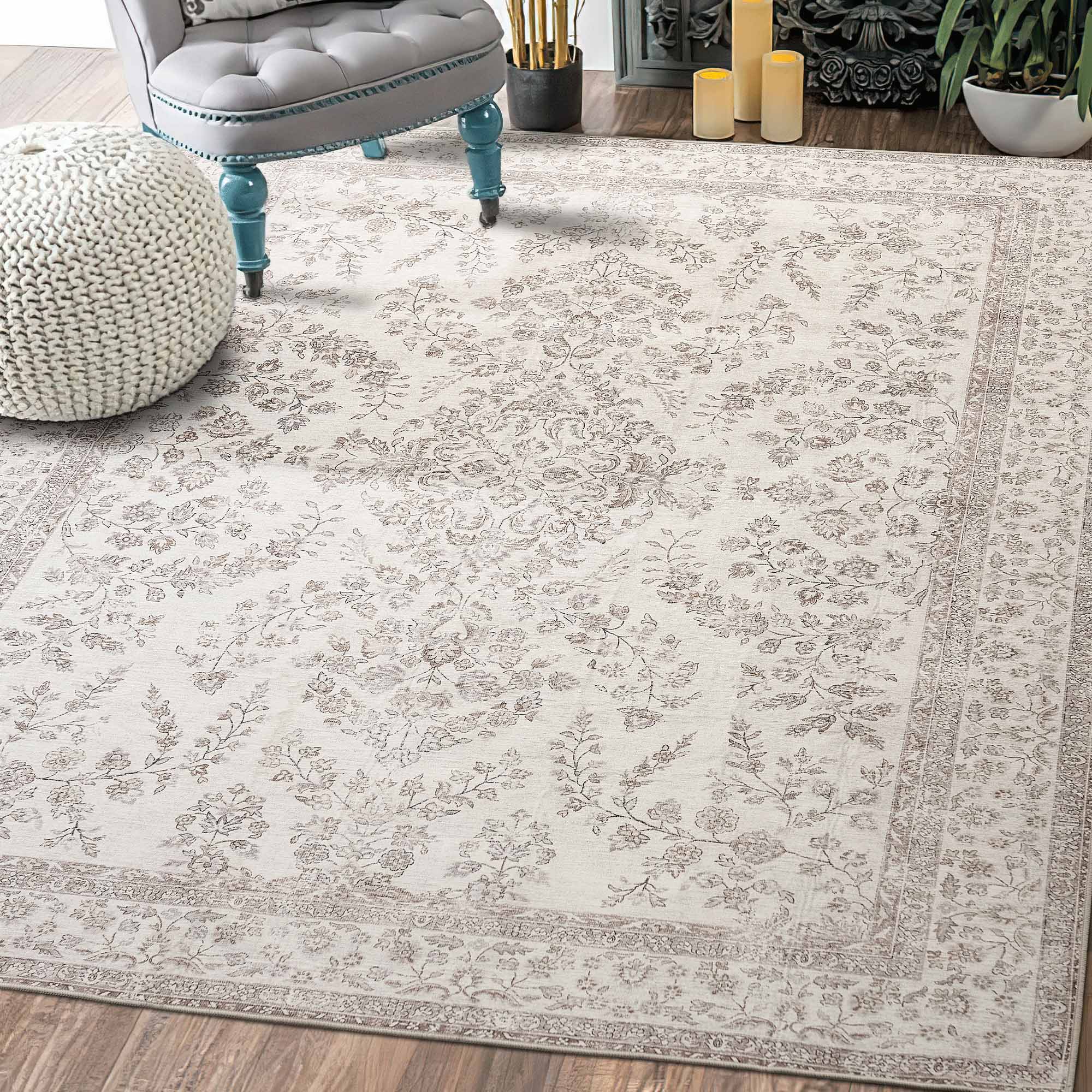 Elegant cream chenille area rug with a subtle "Floral's Dream" light brown pattern and intricate border, softening a wood floor.