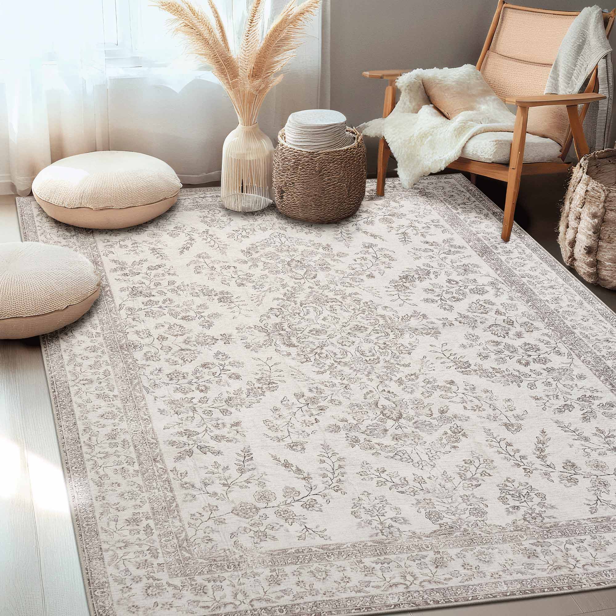 Full room view of the Floral's Dream chenille area rug with its elegant cream and grey floral pattern and decorative border in a cozy setting.