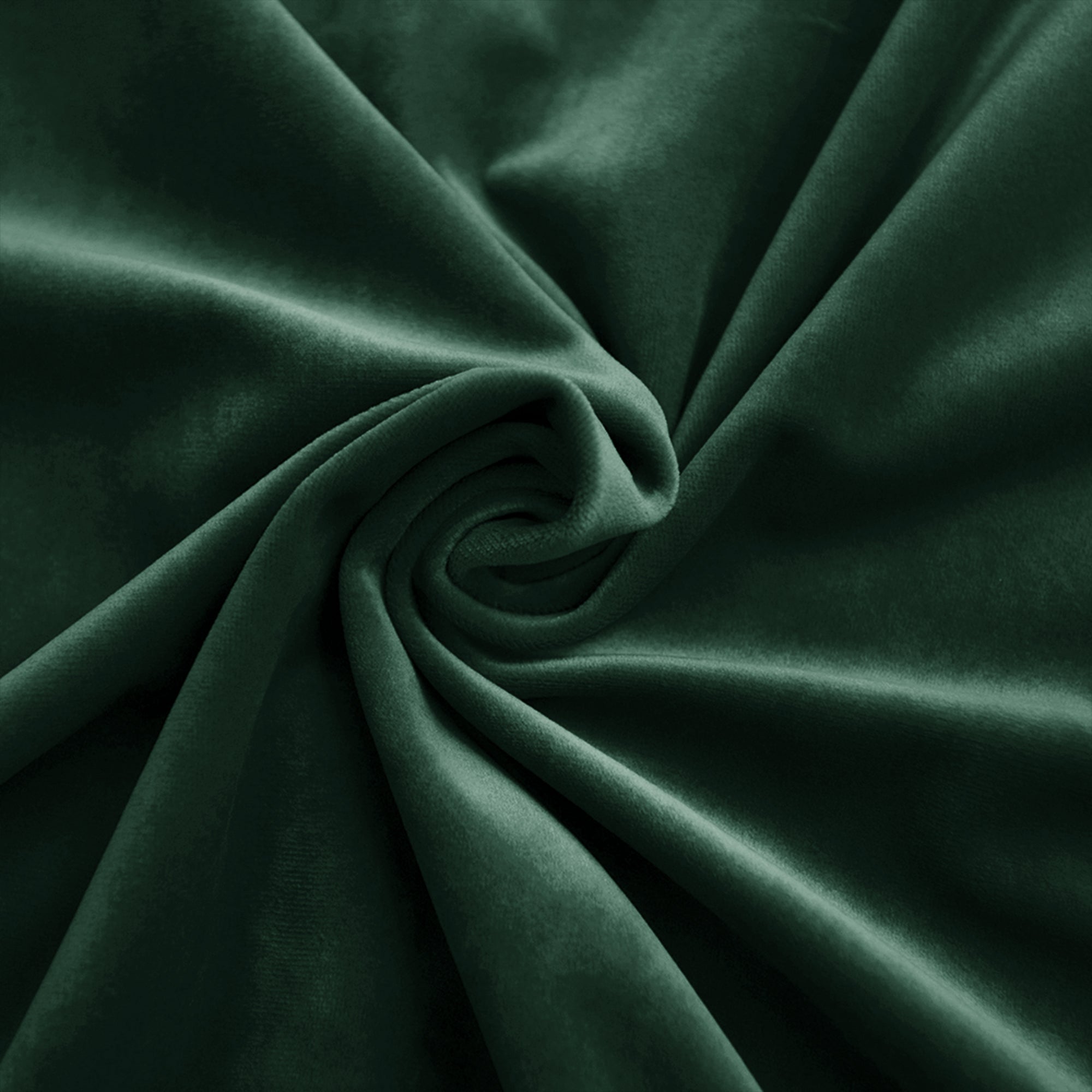 Dark green velvet fabric swirled to highlight its luxurious texture and soft sheen.