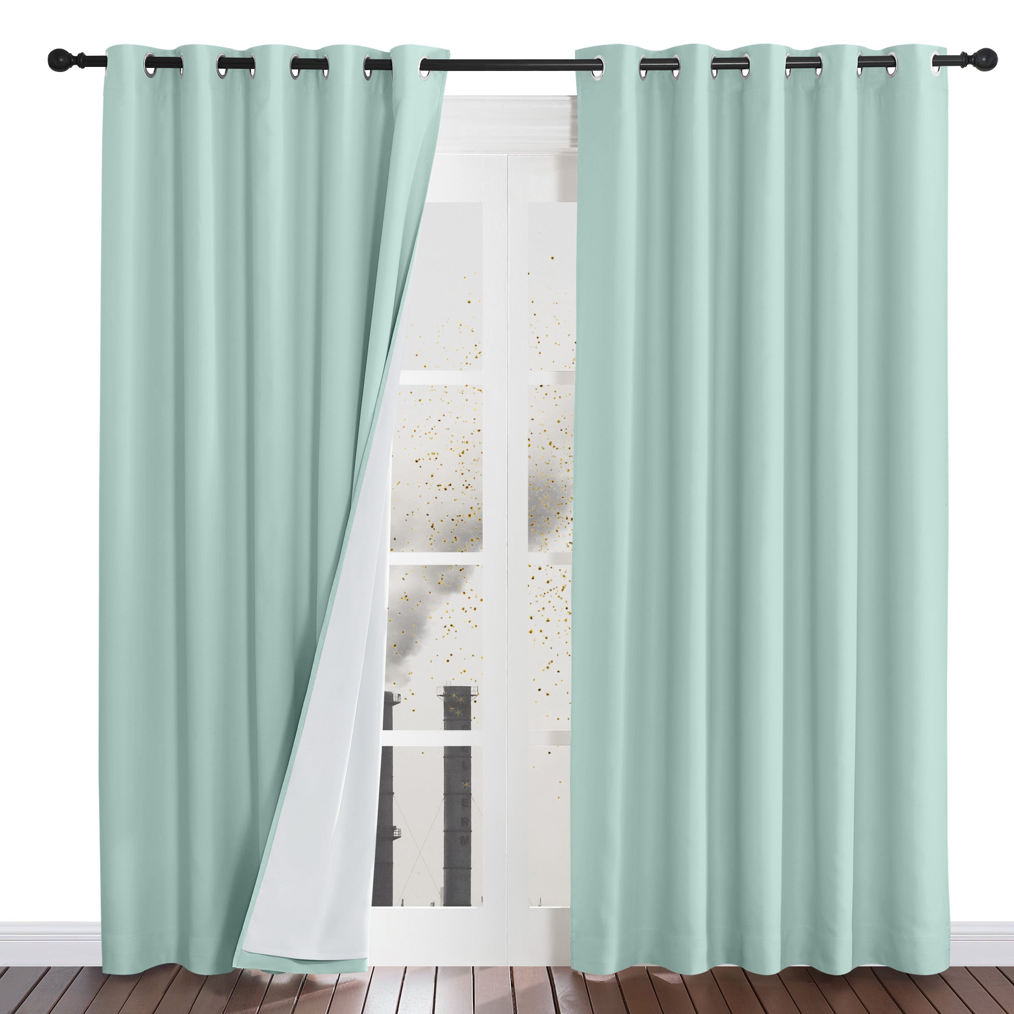 Mint green four-layer dustproof curtains hanging in a window, with one panel pulled back to show the white inner liner.