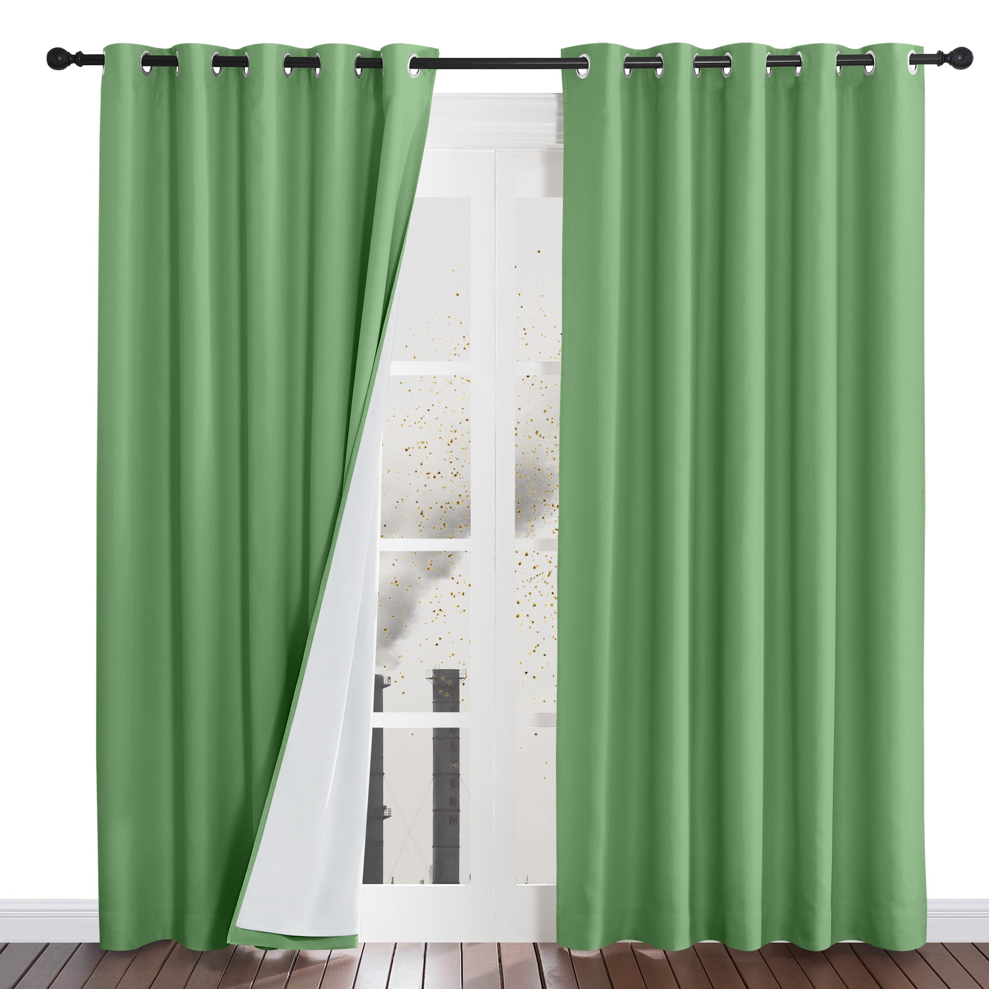 A pair of green four-layer curtains with one panel pulled aside to show the white dustproof inner lining and silver grommets.