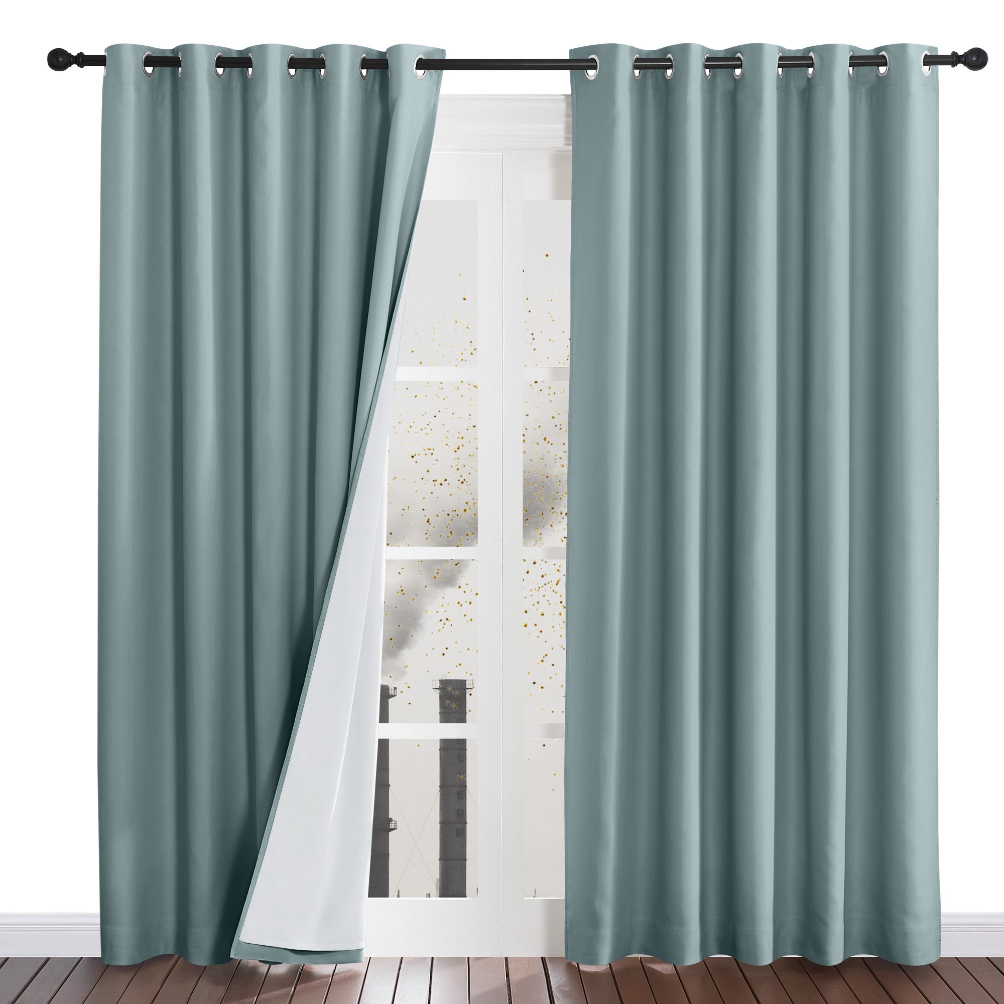 One dusty blue four-layer curtain pulled back to show its white liner, demonstrating how it blocks outside dust and pollution.