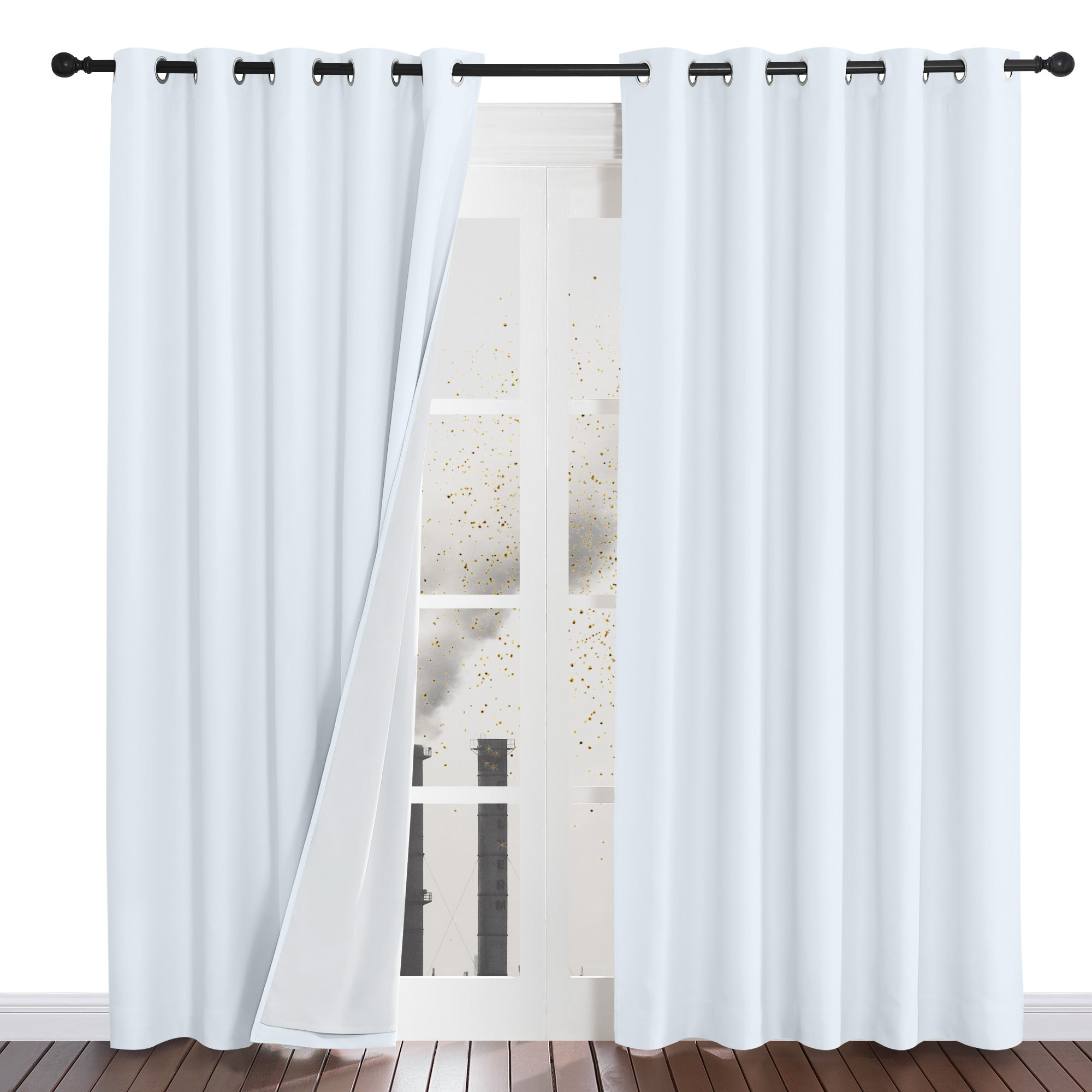 A white four-layer dustproof curtain panel pulled back to show its protective liner blocking simulated dust from a window.