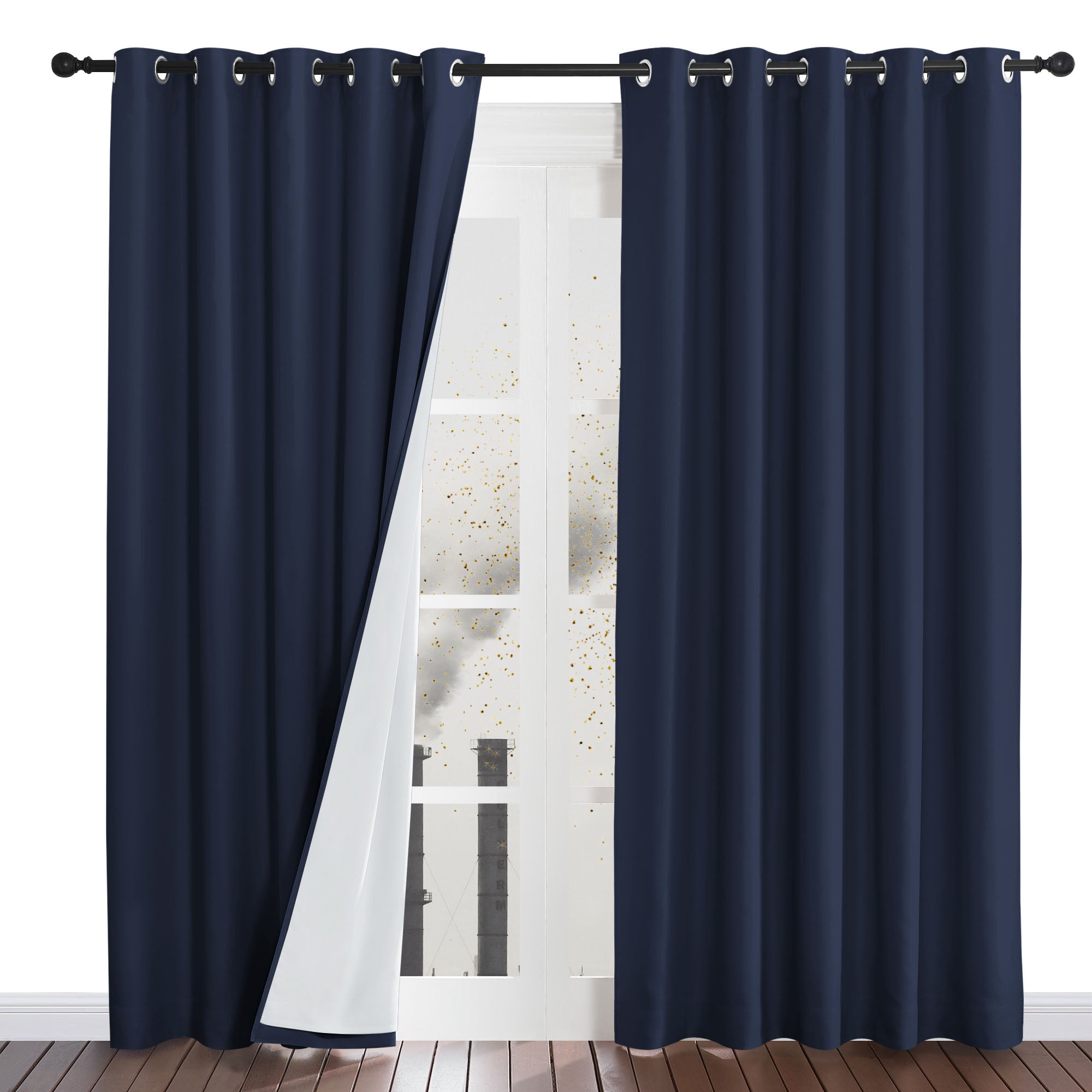 Navy blue four-layer dustproof curtain with the white liner pulled back, shielding a room from outside dust.