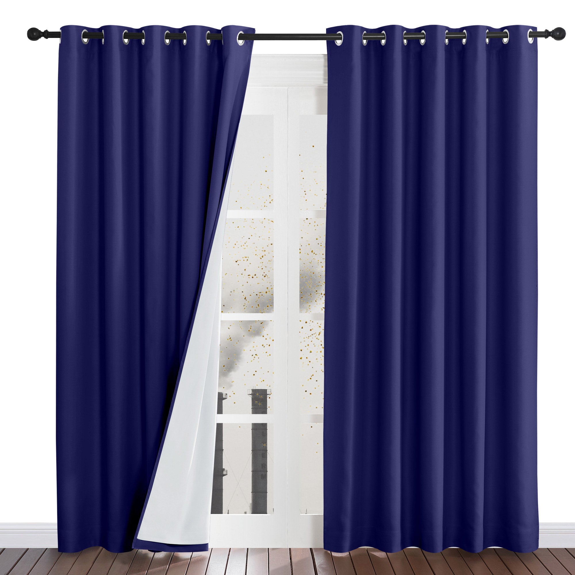 Navy blue dustproof curtains on a rod, with one panel pulled back to reveal the white four-layer liner.