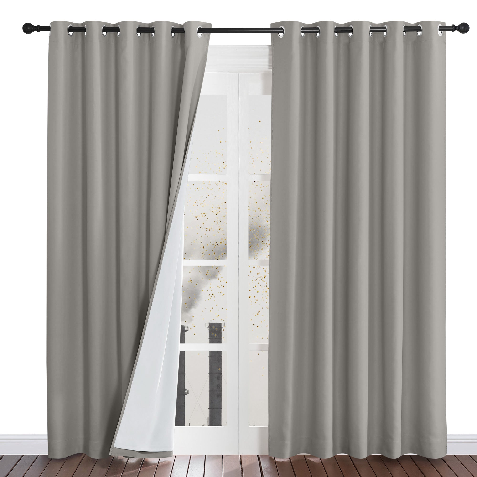 A grey four-layer dustproof curtain panel pulled back to reveal the thick white liner that blocks outside particles.