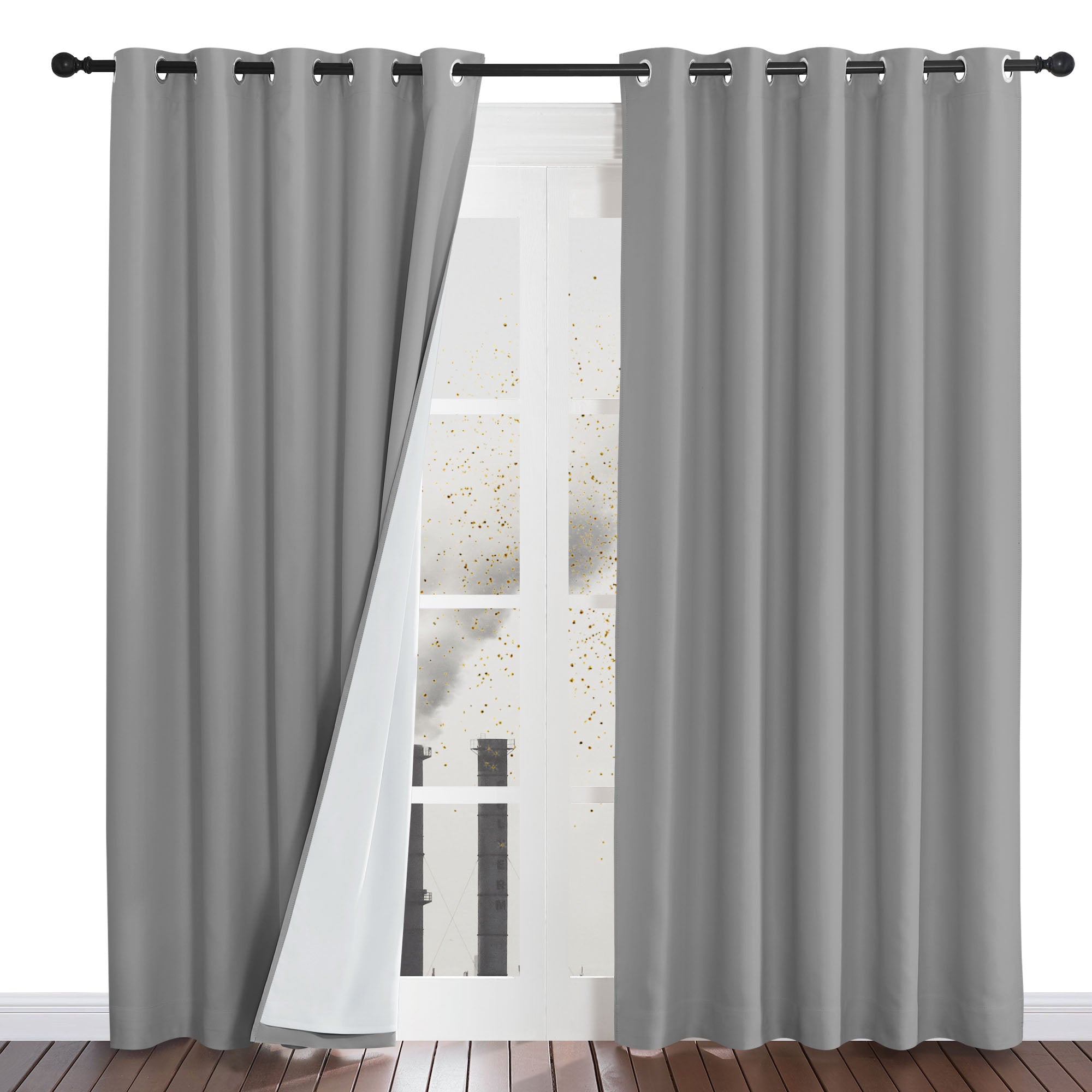 Grey four-layer dustproof grommet curtains on a rod, with one panel open to show the white lining blocking a dusty view.