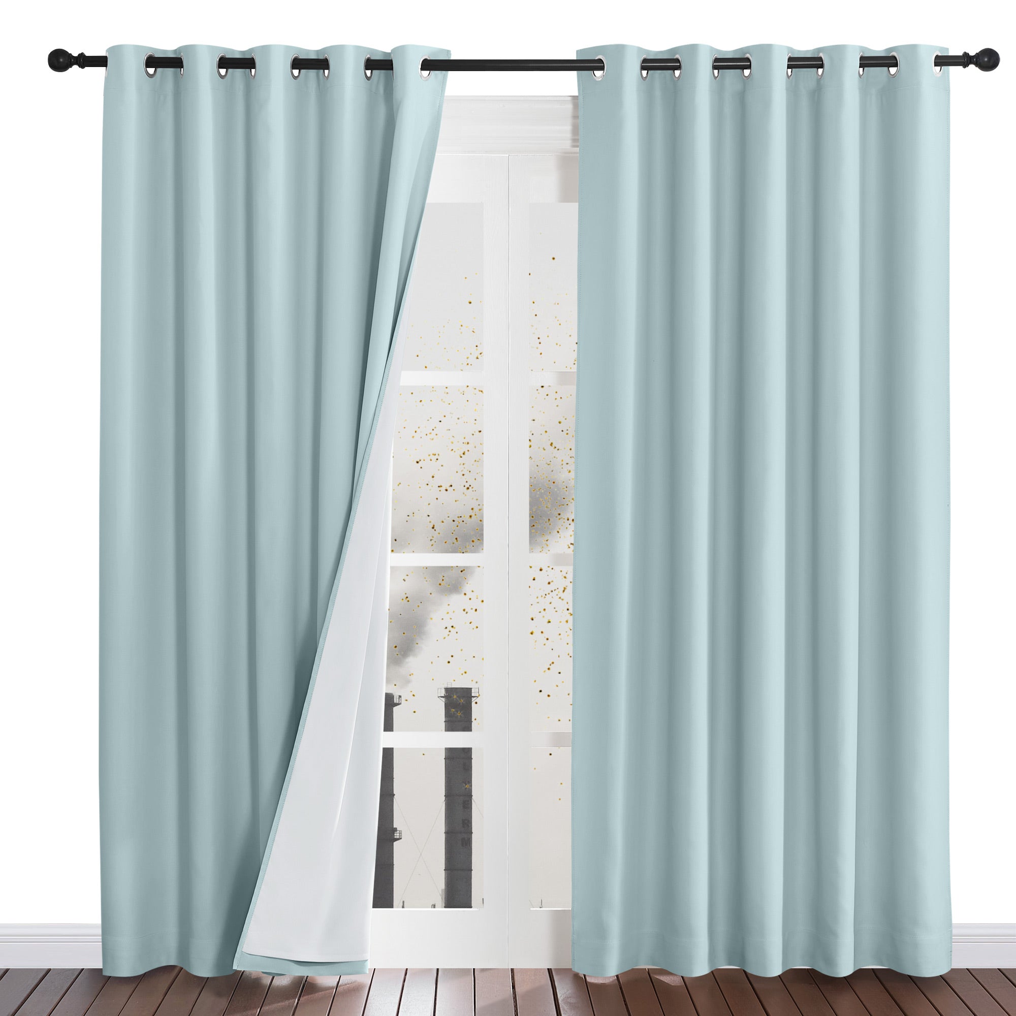 A pair of light blue grommet top curtains, with the left panel pulled aside to reveal the white four-layer dustproof liner.