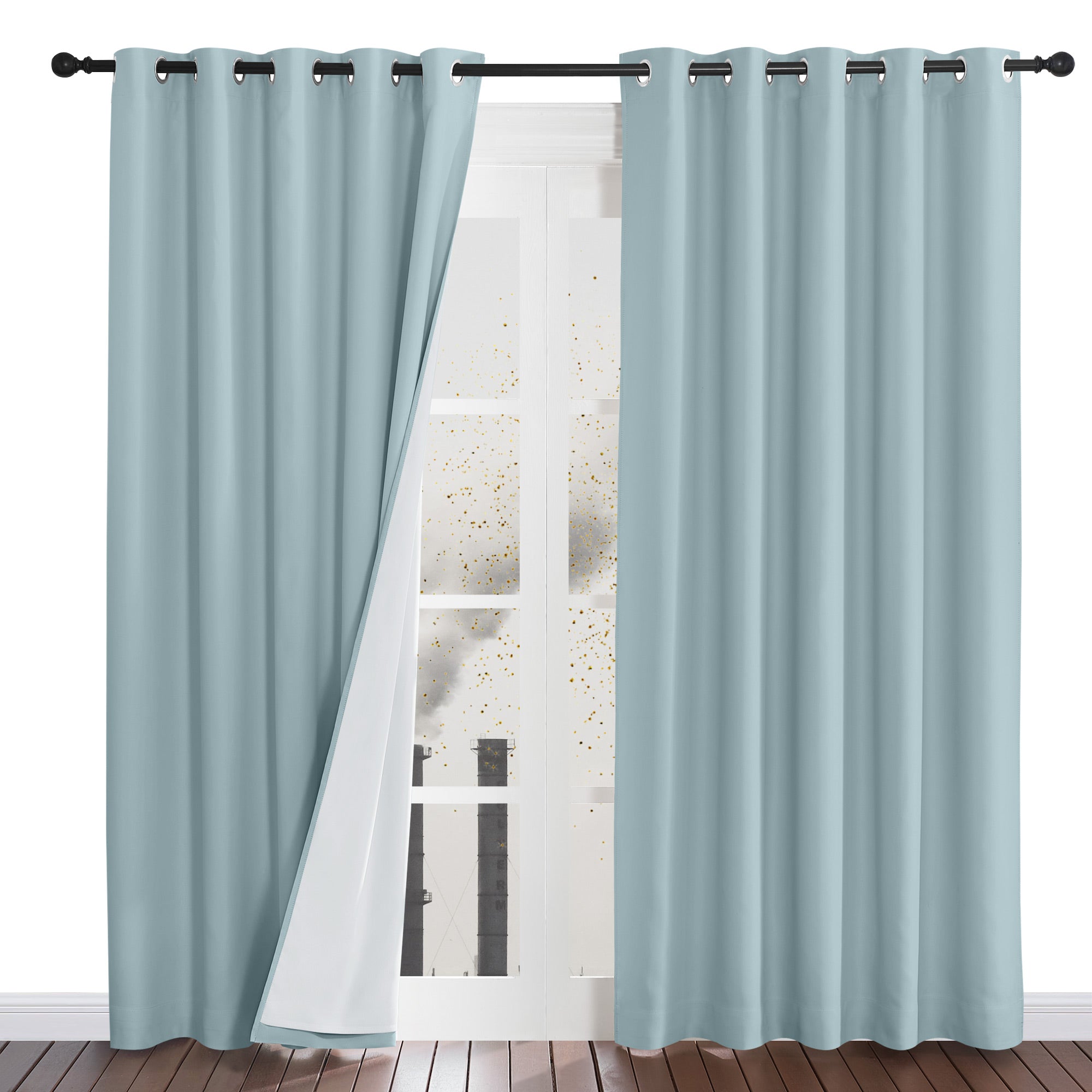 Light blue four-layer dustproof curtain pulled back to reveal its white inner lining and grommet top construction.